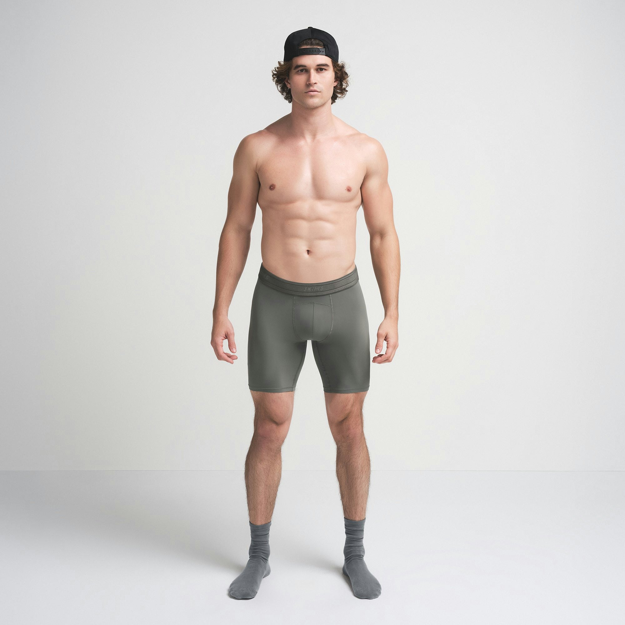 SKIMS SPORT MENS 7" BOXER BRIEF | GUNMETAL ON A MODEL FRONT VIEW | FOCUS: 0.0, 1.0, 0.9