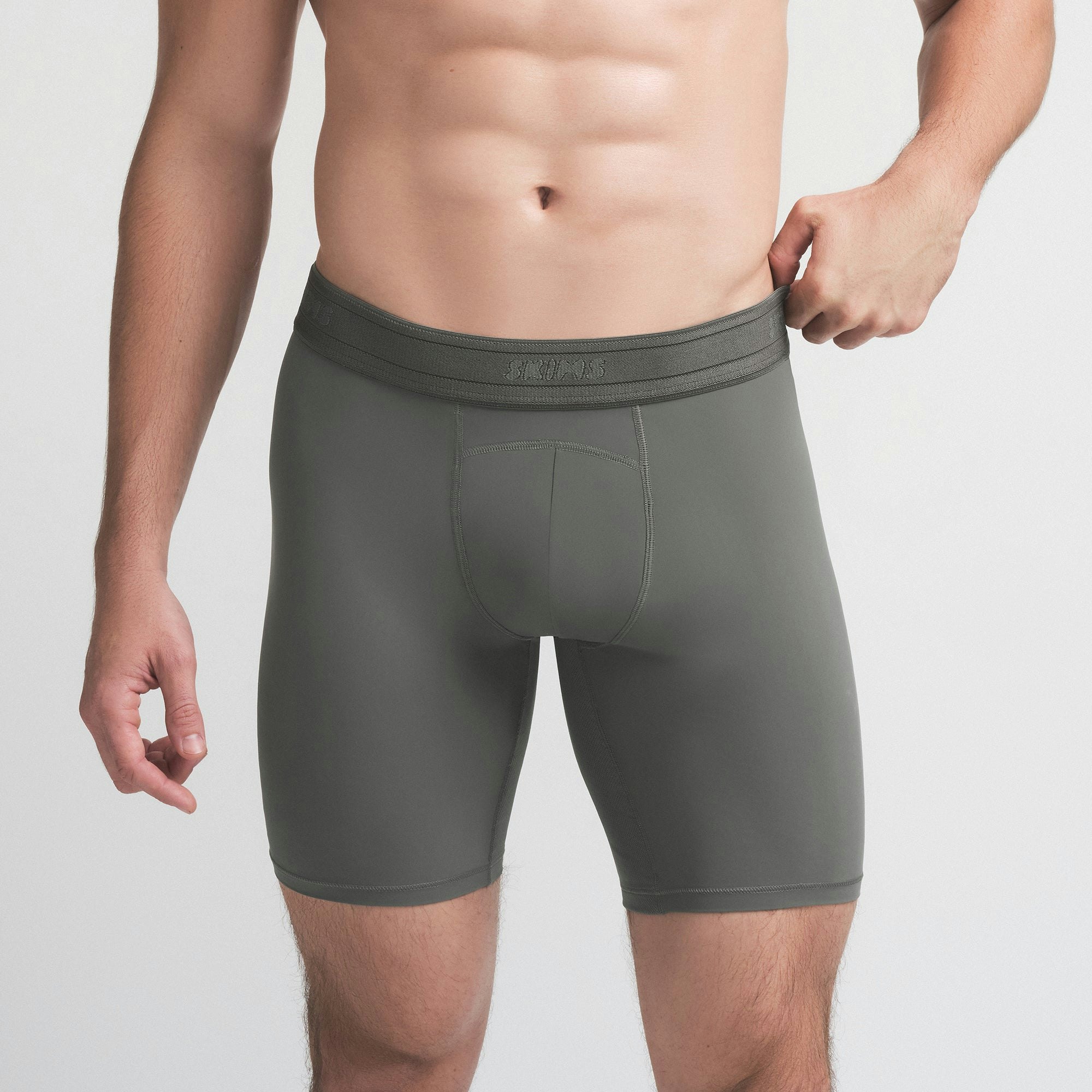 SKIMS SPORT MENS 7" BOXER BRIEF | GUNMETAL ON A MODEL SIDE VIEW | FOCUS: 0.0, 1.0, 0.9