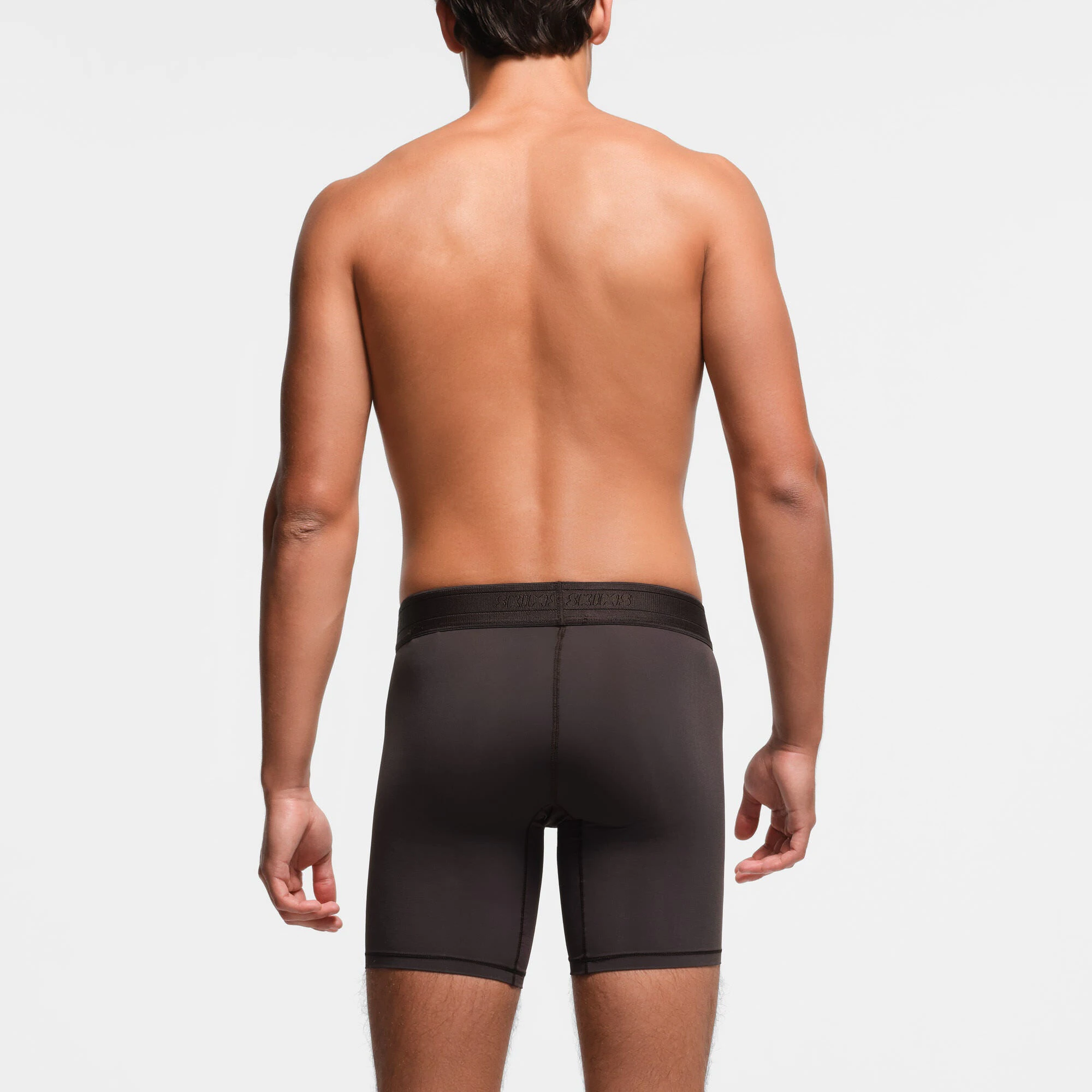 SKIMS SPORT MENS 7" BOXER BRIEF | PHOENIX ON A MODEL BACK VIEW
