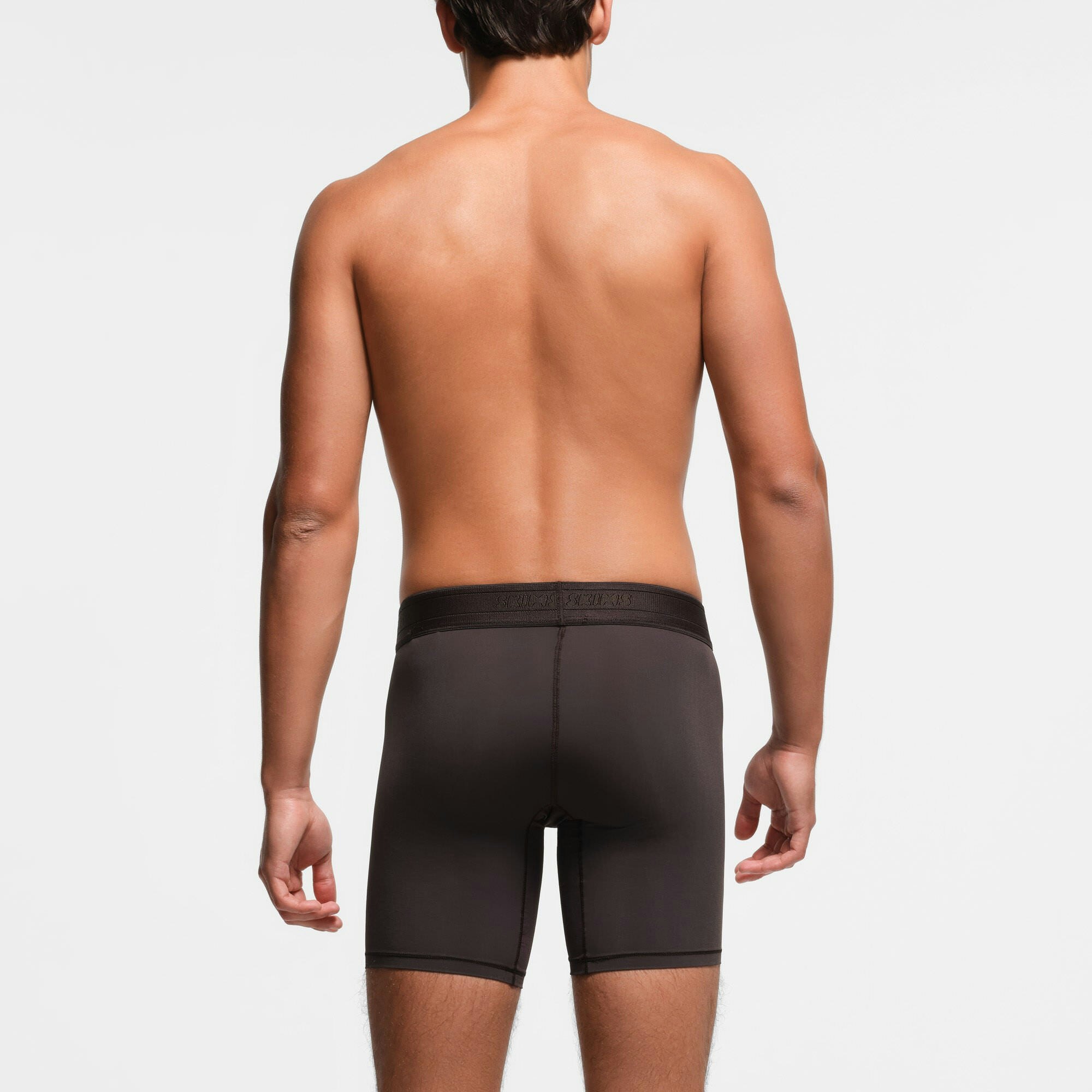 SKIMS SPORT MENS 7" BOXER BRIEF | PHOENIX ON A MODEL BACK VIEW