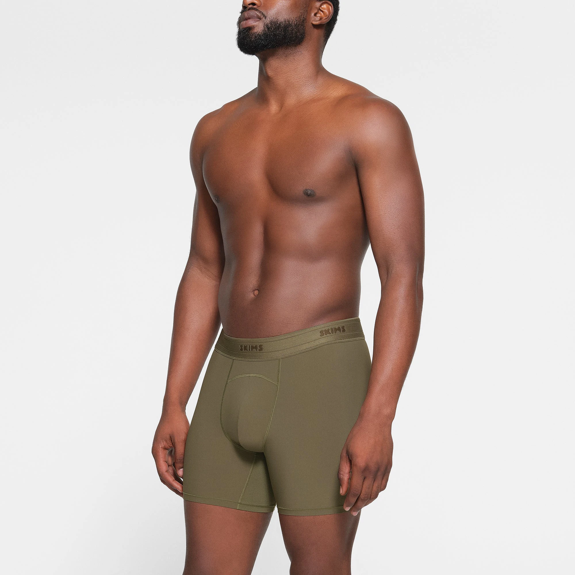 SKIMS SPORT MENS 5" BOXER BRIEF WORN BY A MODEL IN SIDE VIEW