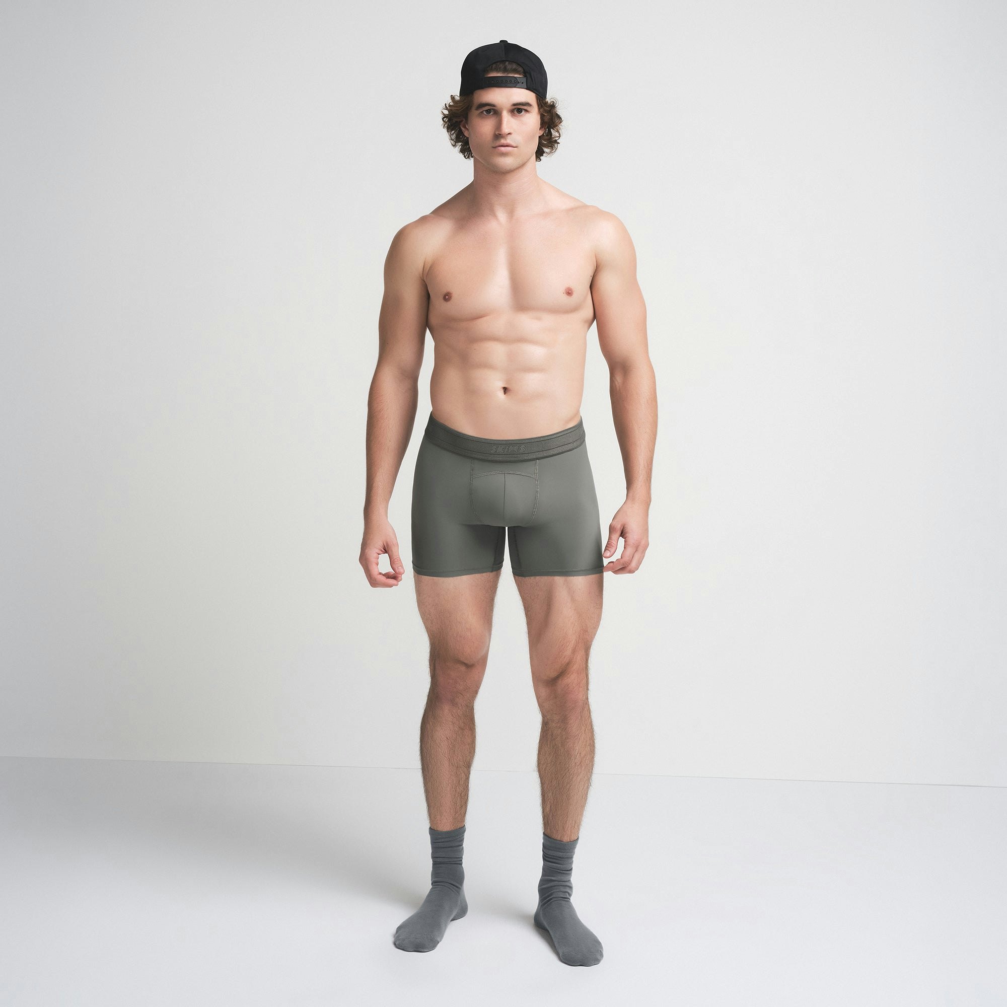 SKIMS SPORT MENS 5" BOXER BRIEF | GUNMETAL ON A MODEL FRONT VIEW | FOCUS: 0.0, 1.0, 0.9