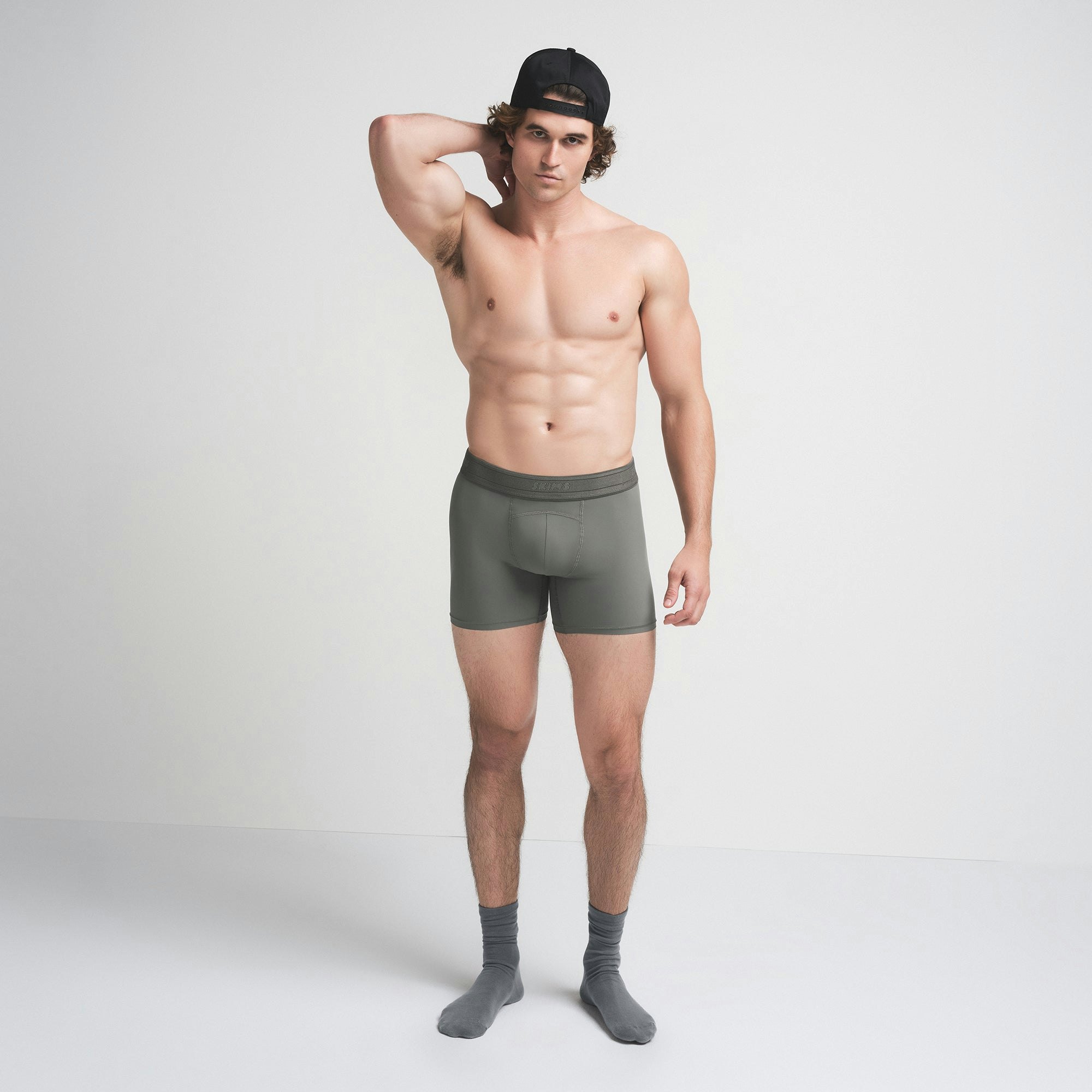 SKIMS SPORT MENS 5" BOXER BRIEF | GUNMETAL ON A MODEL FRONT VIEW | FOCUS: 0.0, 1.0, 0.9