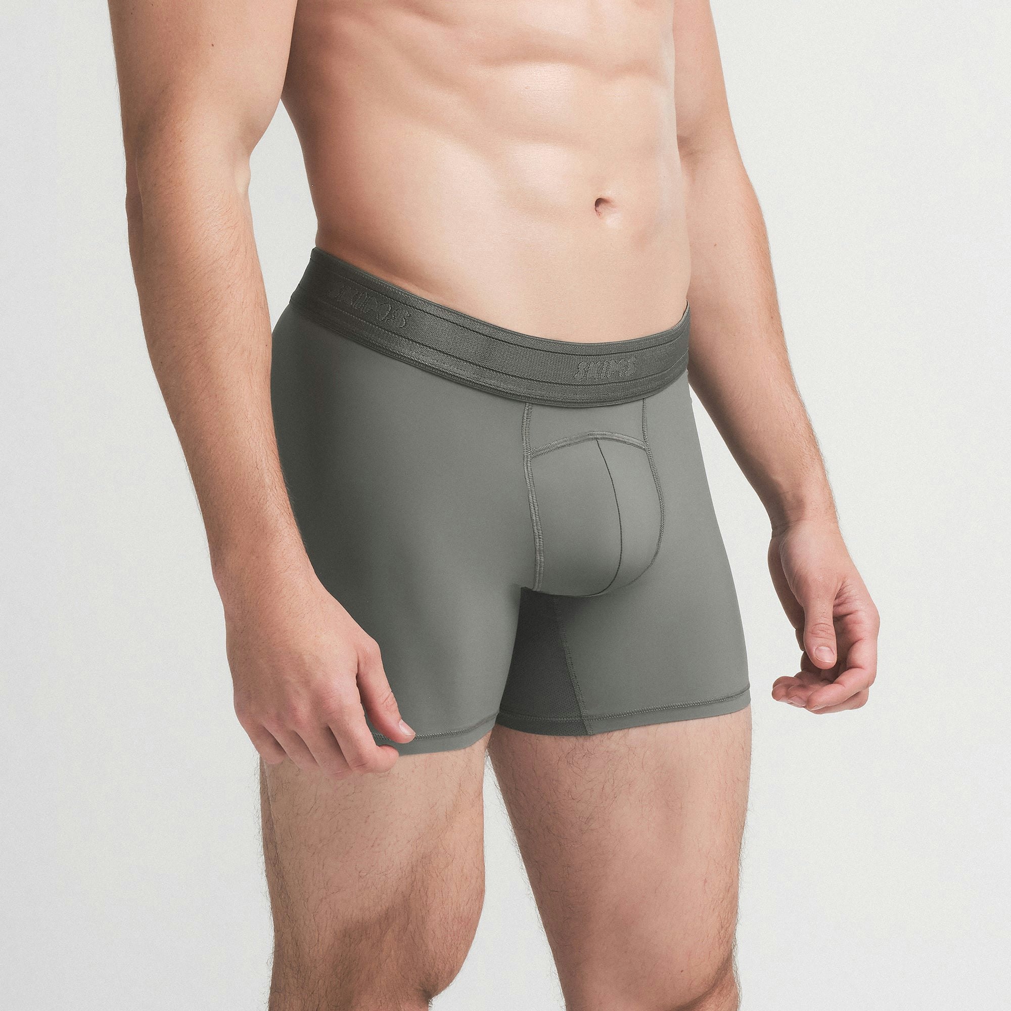 SKIMS SPORT MENS 5" BOXER BRIEF | GUNMETAL ON A MODEL SIDE VIEW | FOCUS: 0.0, 1.0, 0.9