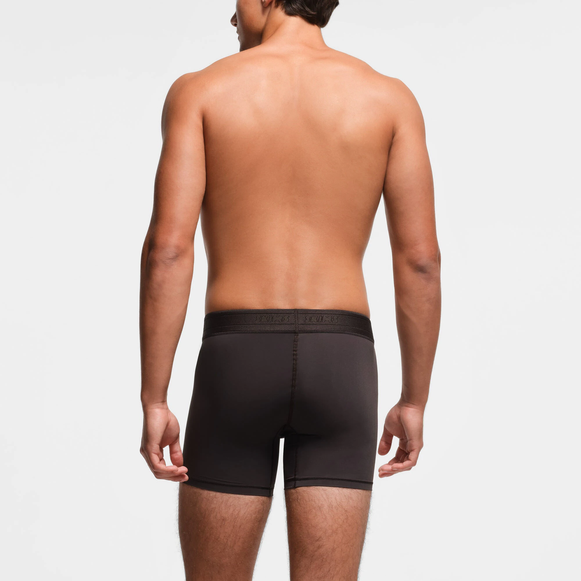 SKIMS SPORT MENS 5" BOXER BRIEF | PHOENIX ON A MODEL BACK VIEW