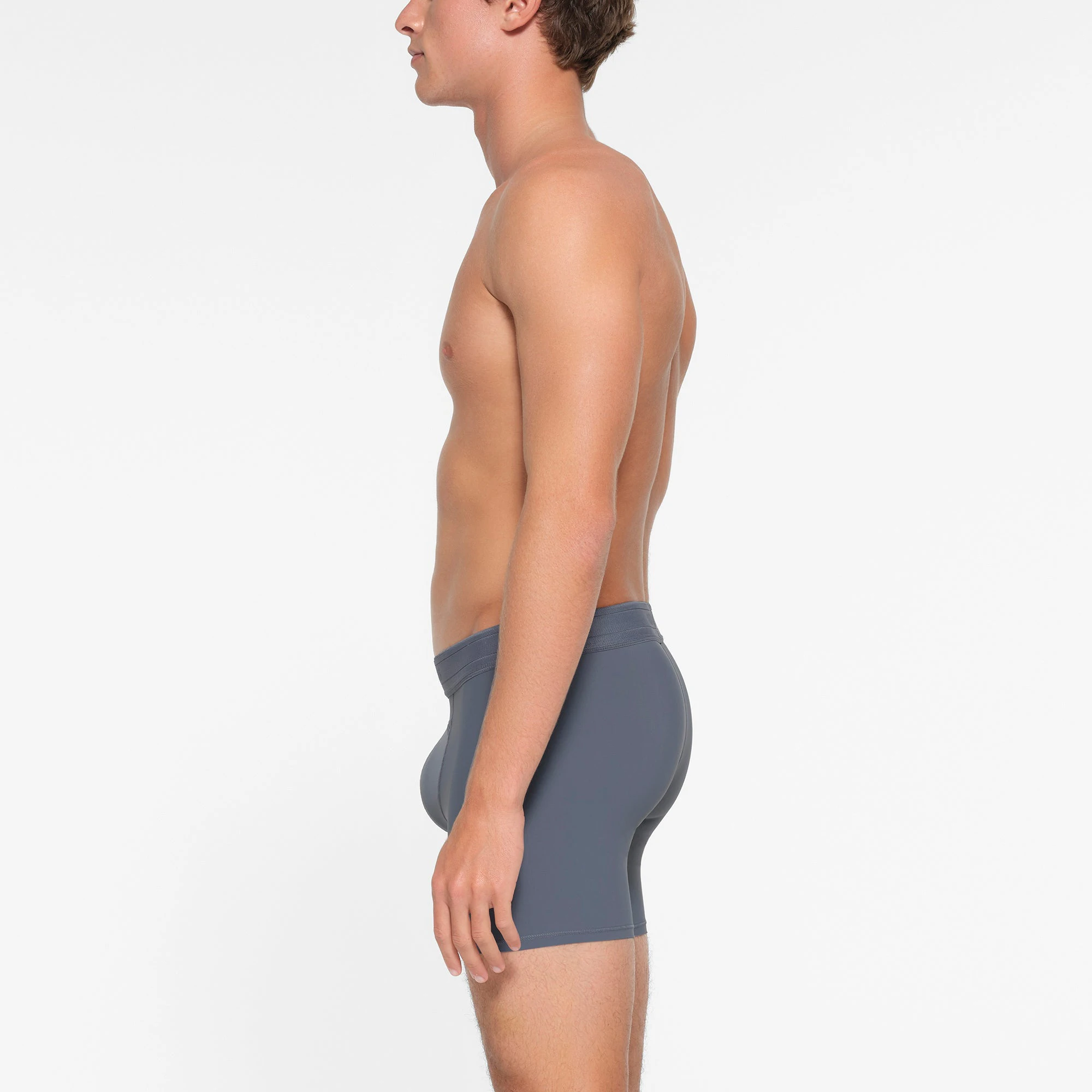 SKIMS SPORT MENS 5" BOXER BRIEF | STEEL BLUE  ON A MODEL SIDE VIEW
