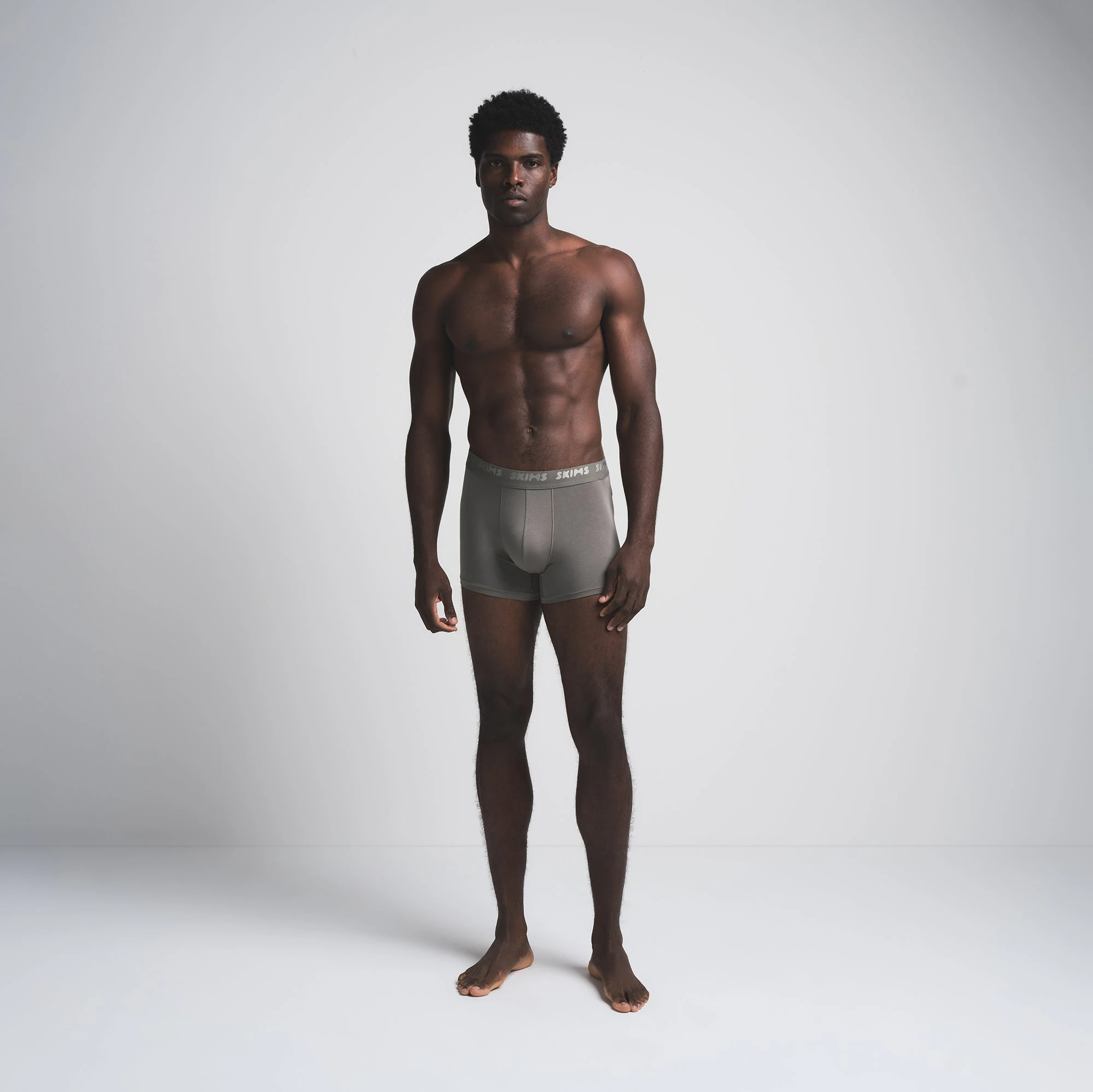 SKIMS STRETCH MENS 3 INCH BOXER BRIEF 3-PACK | BRICK MULTI ON A MODEL FRONT VIEW