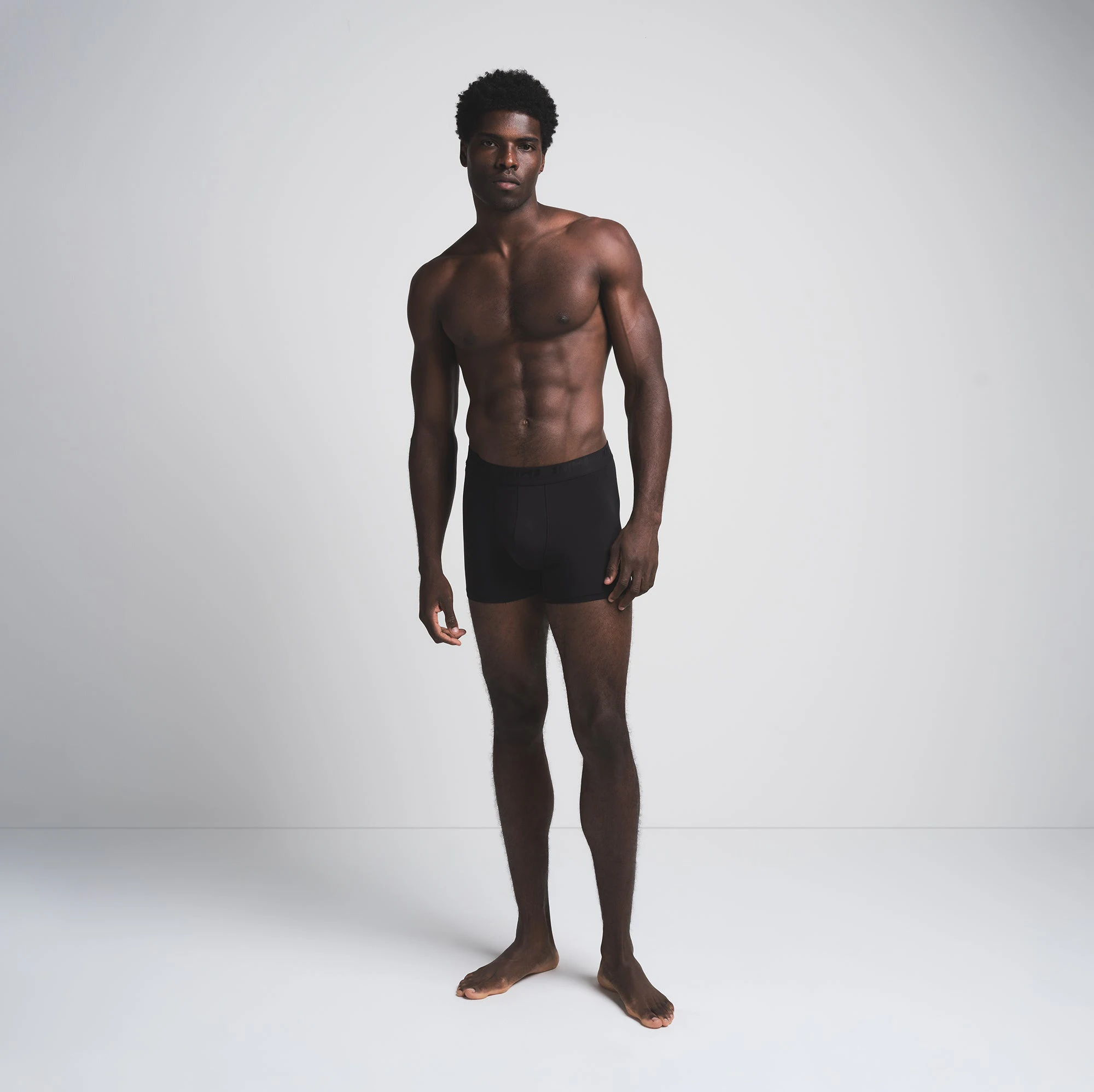 SKIMS STRETCH MENS 3 INCH BOXER BRIEF 3-PACK | BRICK MULTI ON A MODEL FRONT VIEW