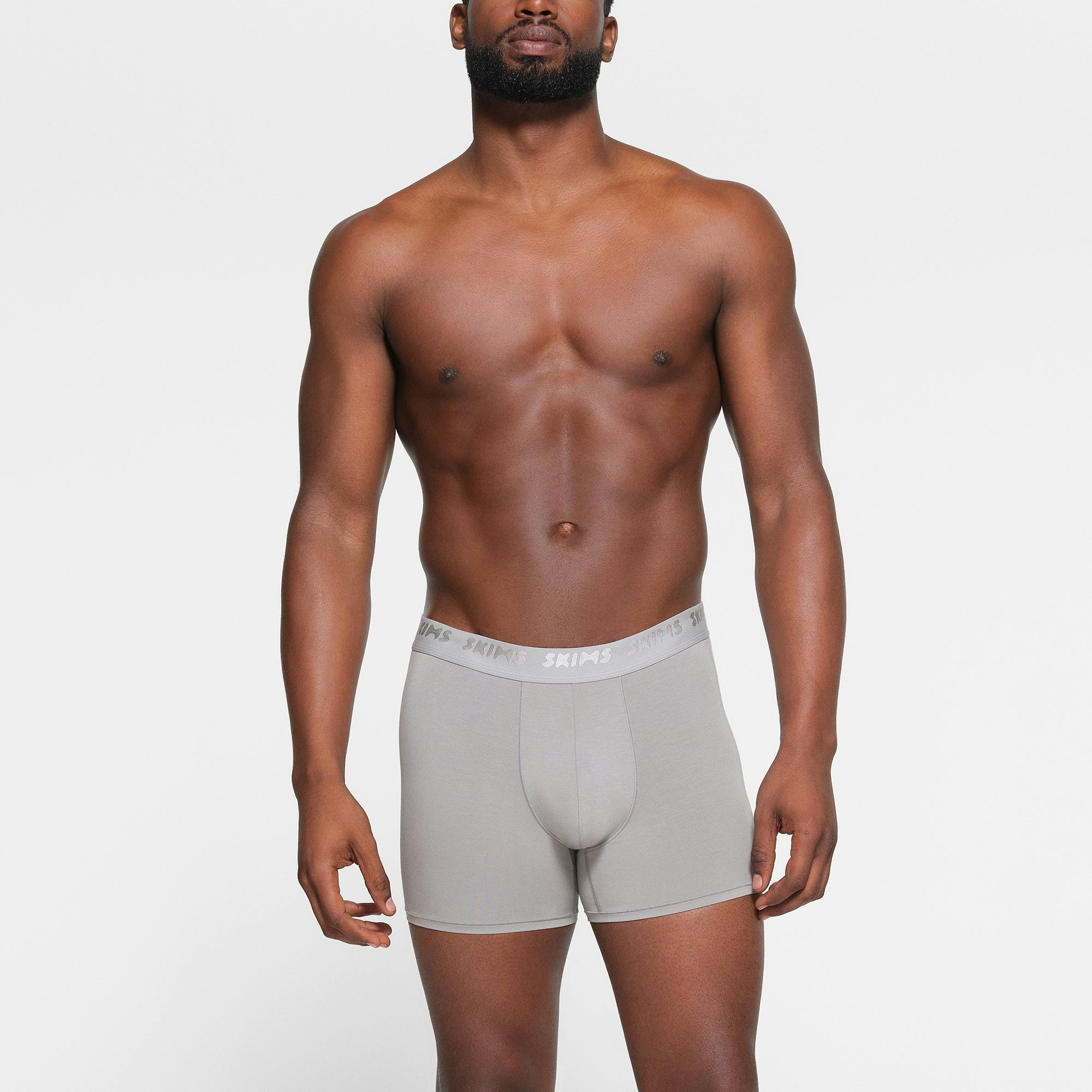 SKIMS STRETCH MENS 3" BOXER BRIEF 3-PACK WORN BY A MODEL IN FRONT VIEW