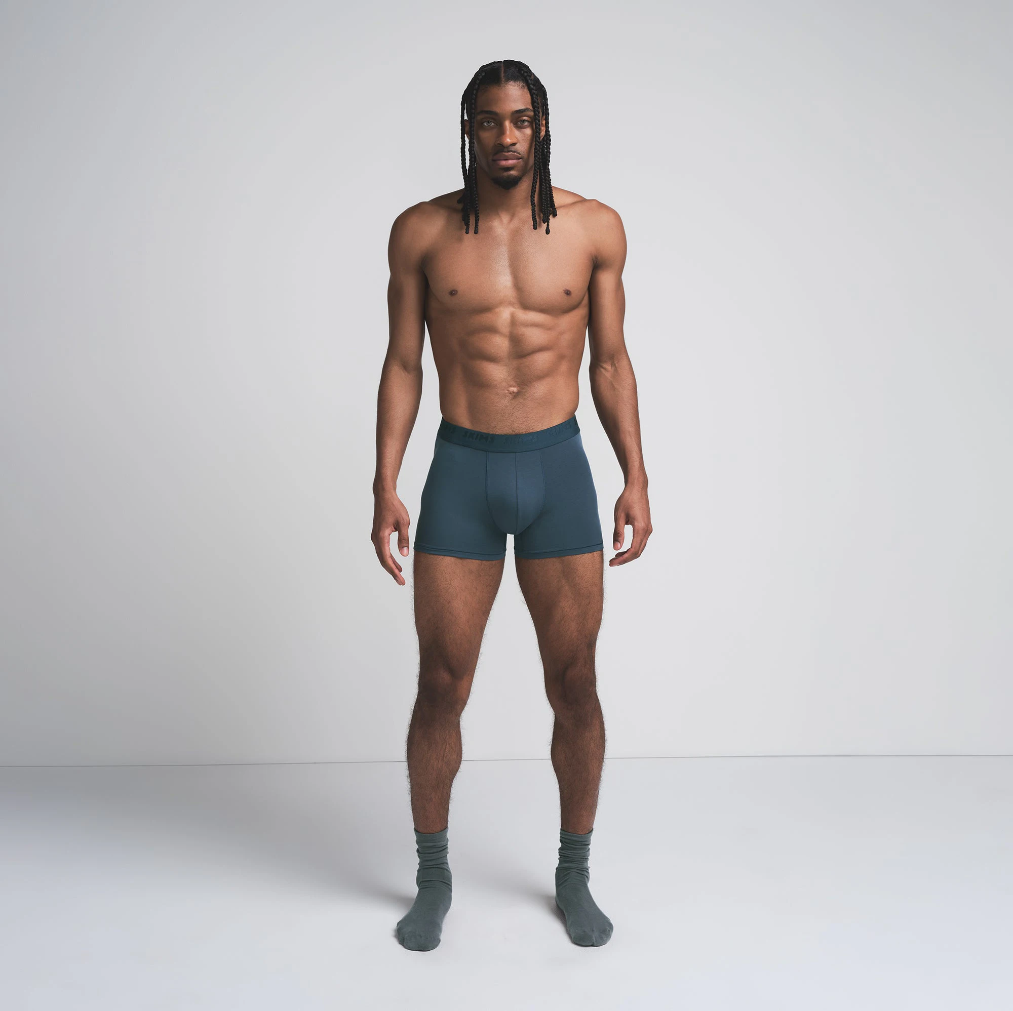 SKIMS STRETCH MENS 3 INCH BOXER BRIEF 3-PACK | INDIGO MULTI ON A MODEL FRONT VIEW | FOCUS: 0.0, 1.0, 0.9