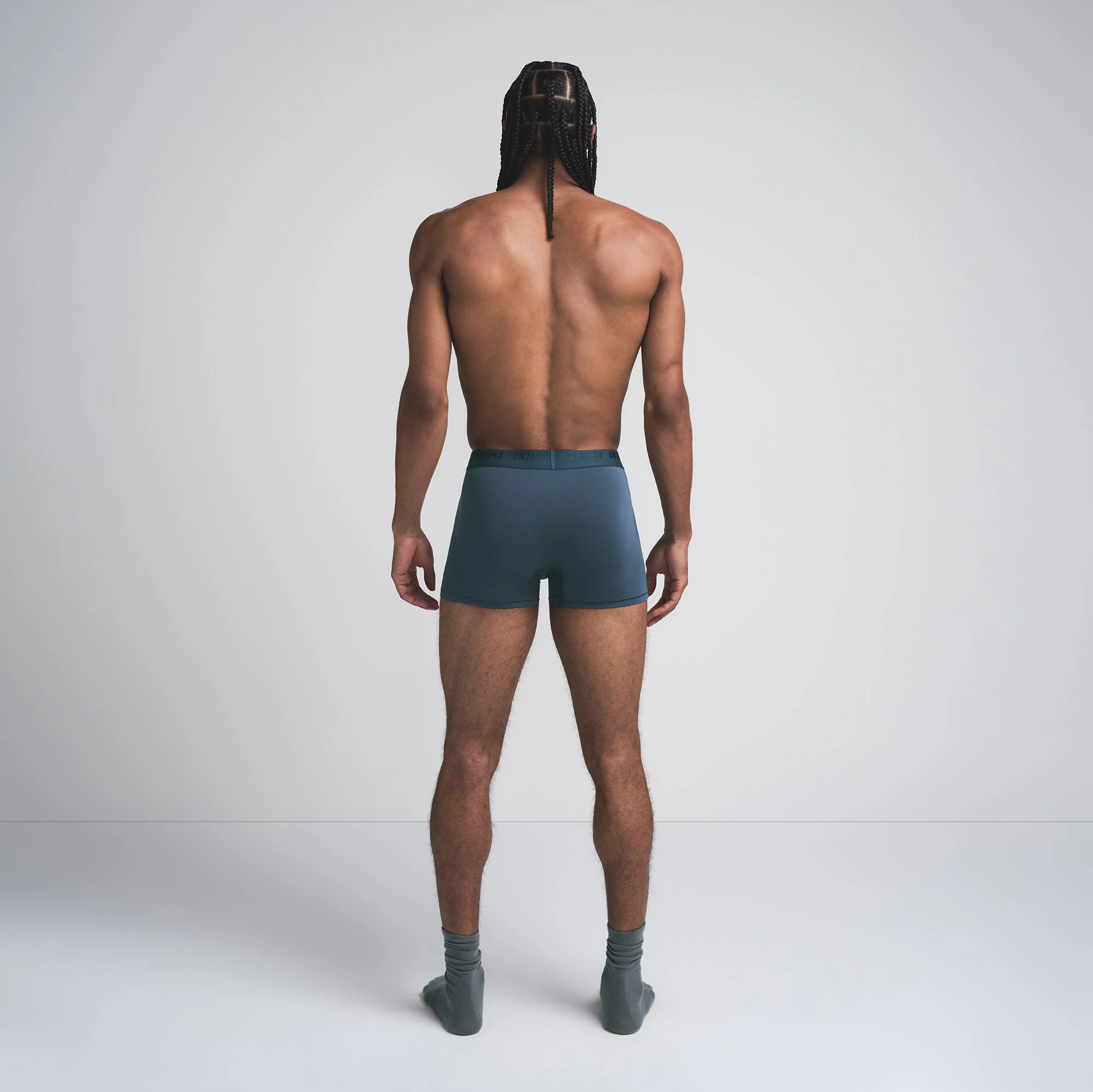 SKIMS STRETCH MENS 3 INCH BOXER BRIEF 3-PACK | INDIGO MULTI ON A MODEL BACK VIEW
