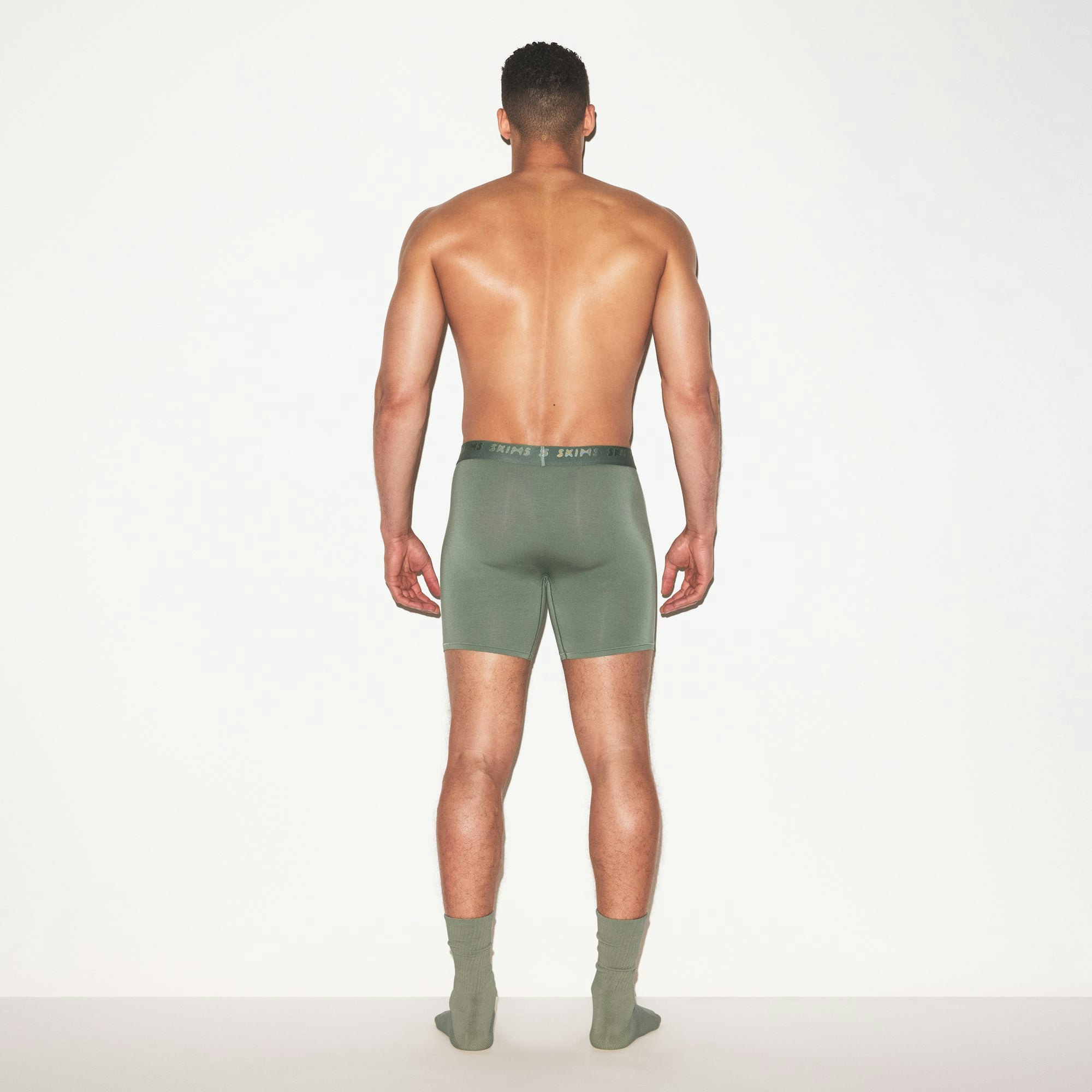 SKIMS STRETCH MENS 3 INCH BOXER BRIEF 3-PACK | LAUREL MULTI ON A MODEL FRONT VIEW | FOCUS: 0.0, 1.0, 0.9
