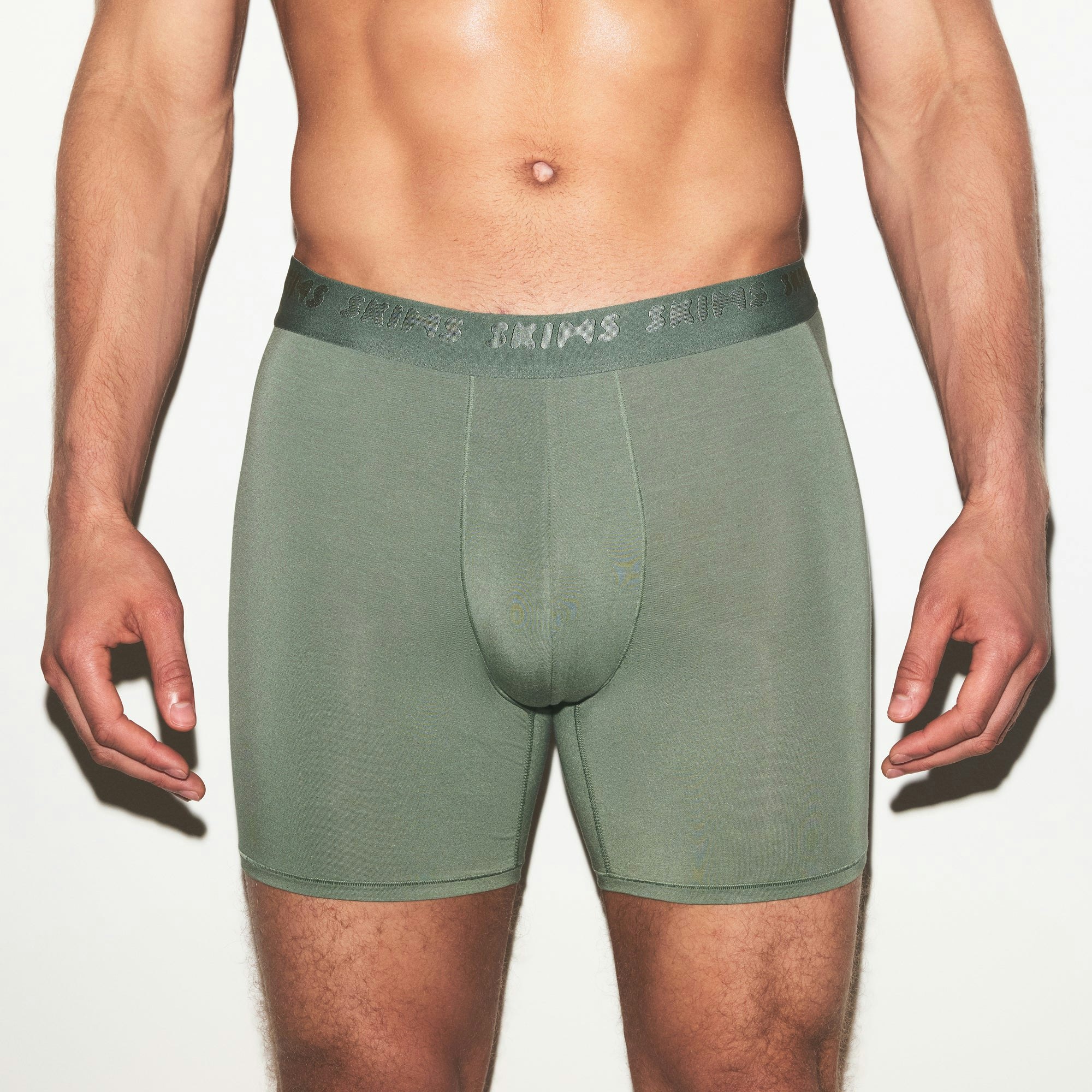 SKIMS STRETCH MENS 3 INCH BOXER BRIEF 3-PACK | LAUREL MULTI ON A MODEL SIDE VIEW | FOCUS: 0.0, 1.0, 0.9