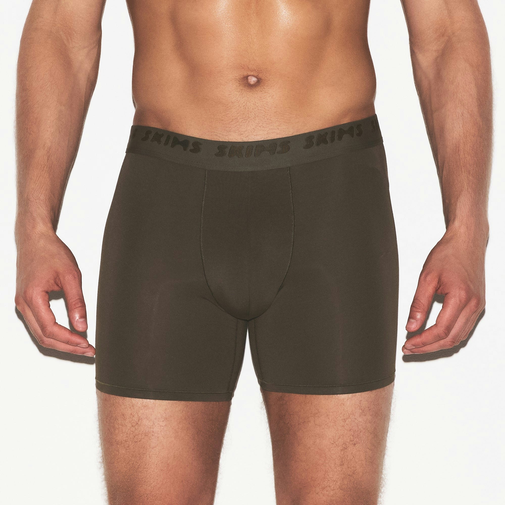 SKIMS STRETCH MENS 3 INCH BOXER BRIEF 3-PACK | LAUREL MULTI ON A MODEL SIDE VIEW | FOCUS: 0.0, 1.0, 0.9