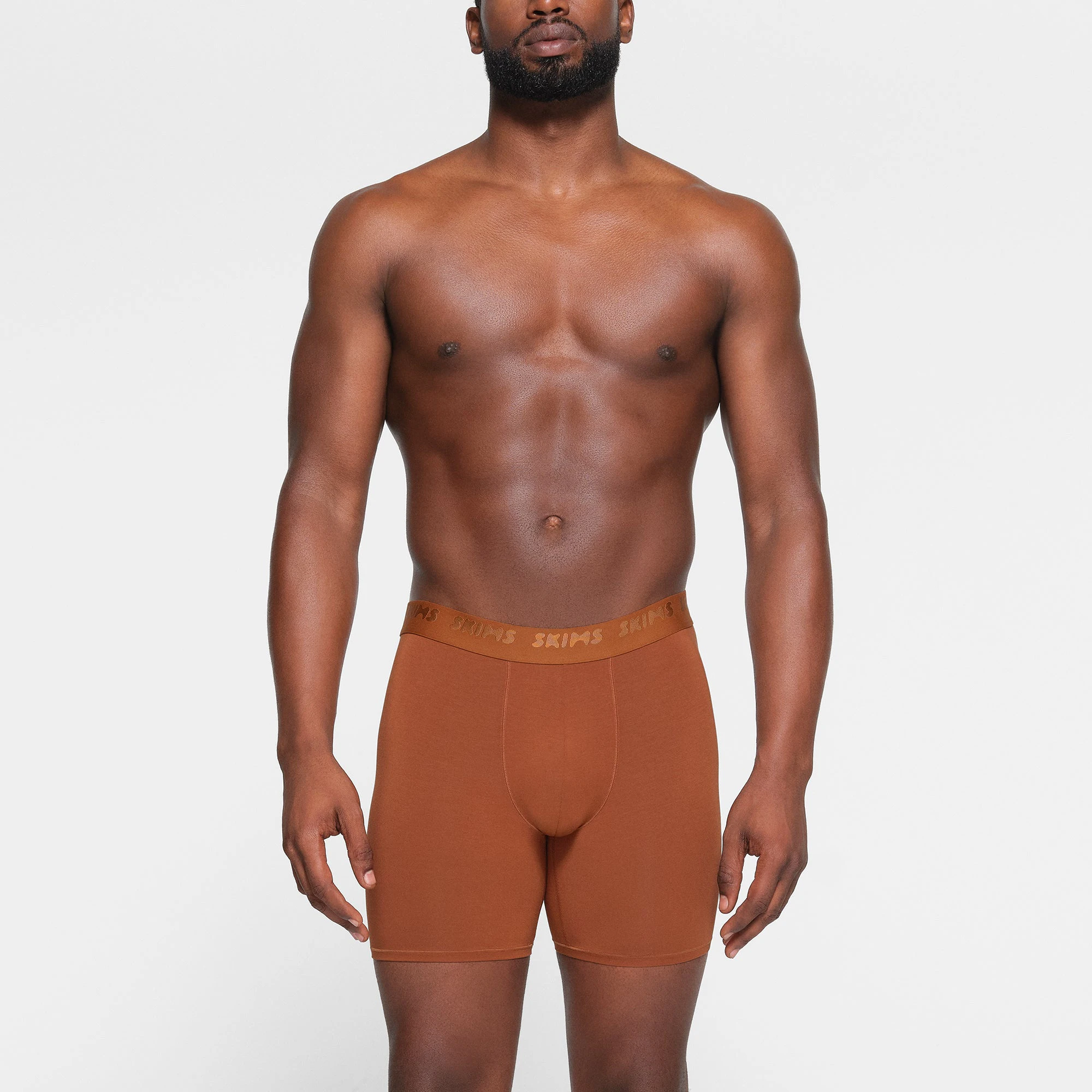 SKIMS STRETCH MENS 5" BOXER BRIEF 3-PACK WORN BY A MODEL IN FRONT VIEW