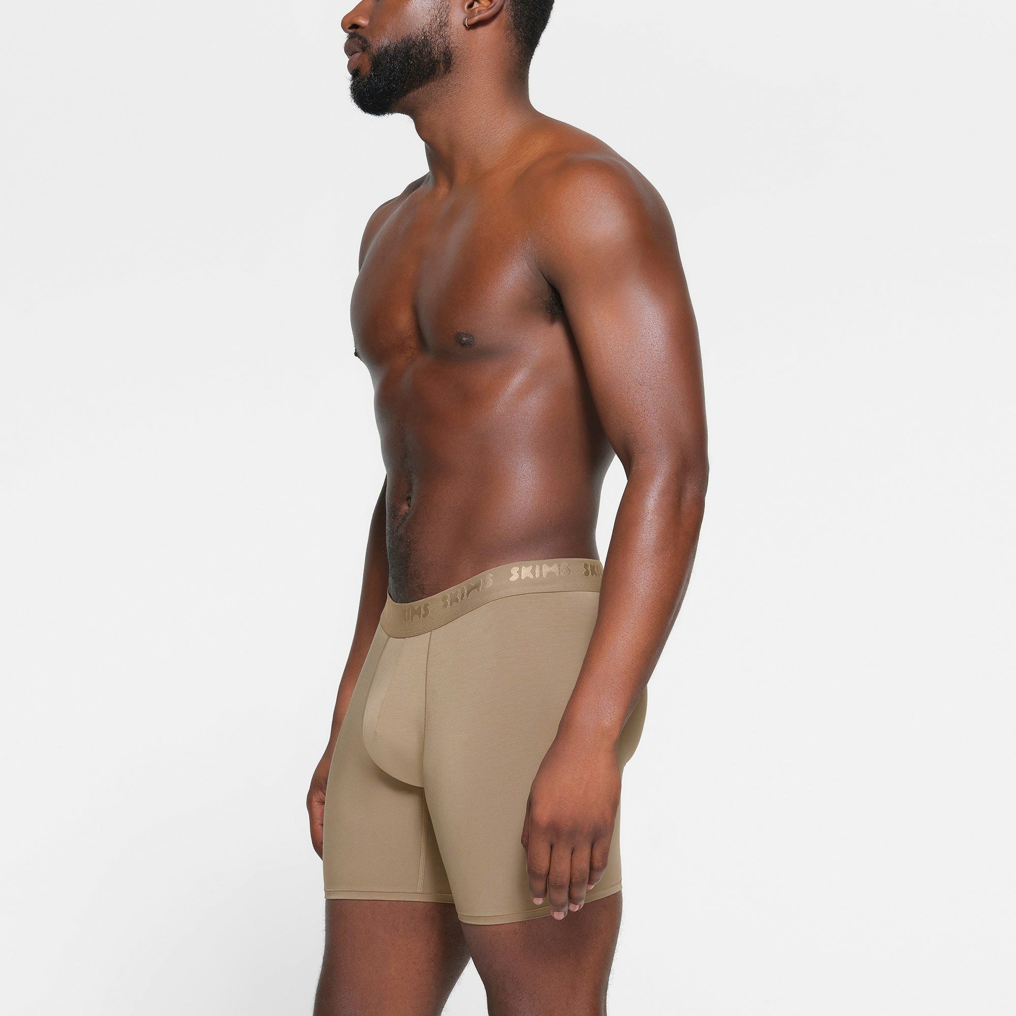 SKIMS STRETCH MENS 5" BOXER BRIEF 3-PACK | DESERT MULTI ON A MODEL SIDE VIEW