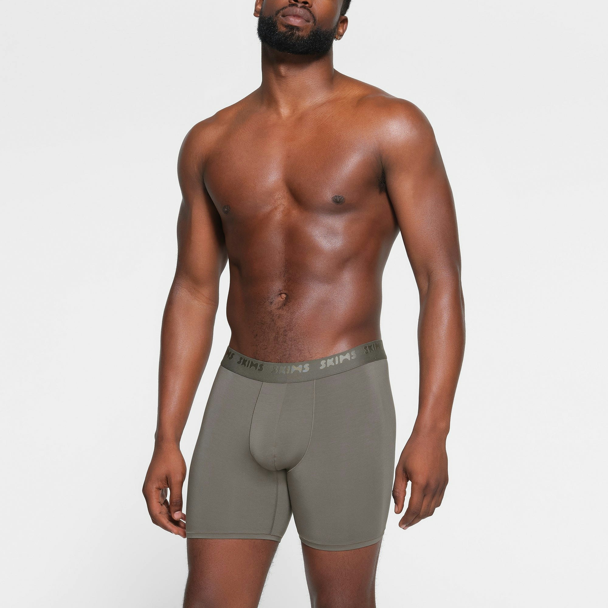 SKIMS STRETCH MENS 5" BOXER BRIEF 3-PACK | DESERT MULTI ON A MODEL FRONT VIEW