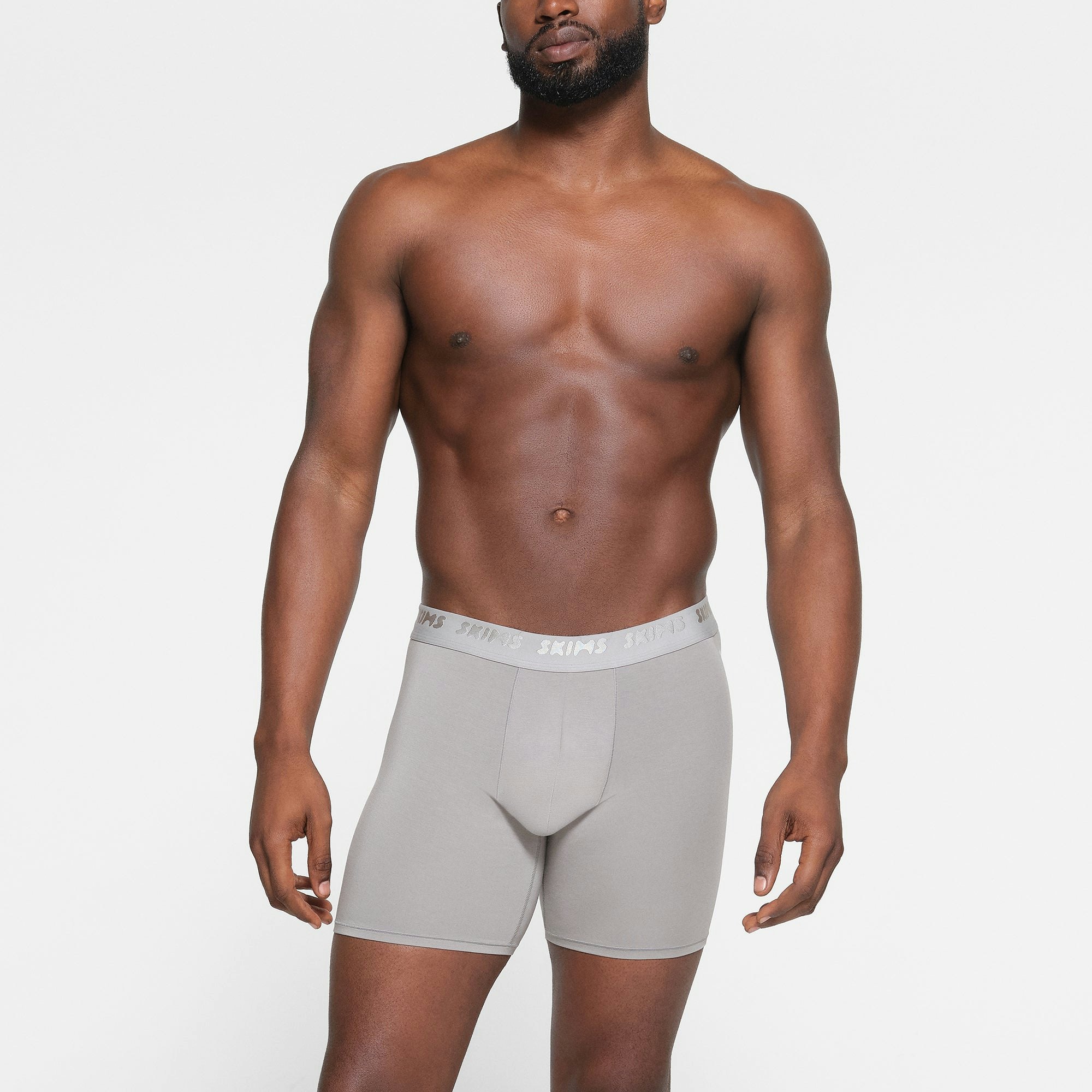 SKIMS STRETCH MENS 5" BOXER BRIEF 3-PACK WORN BY A MODEL IN FRONT VIEW