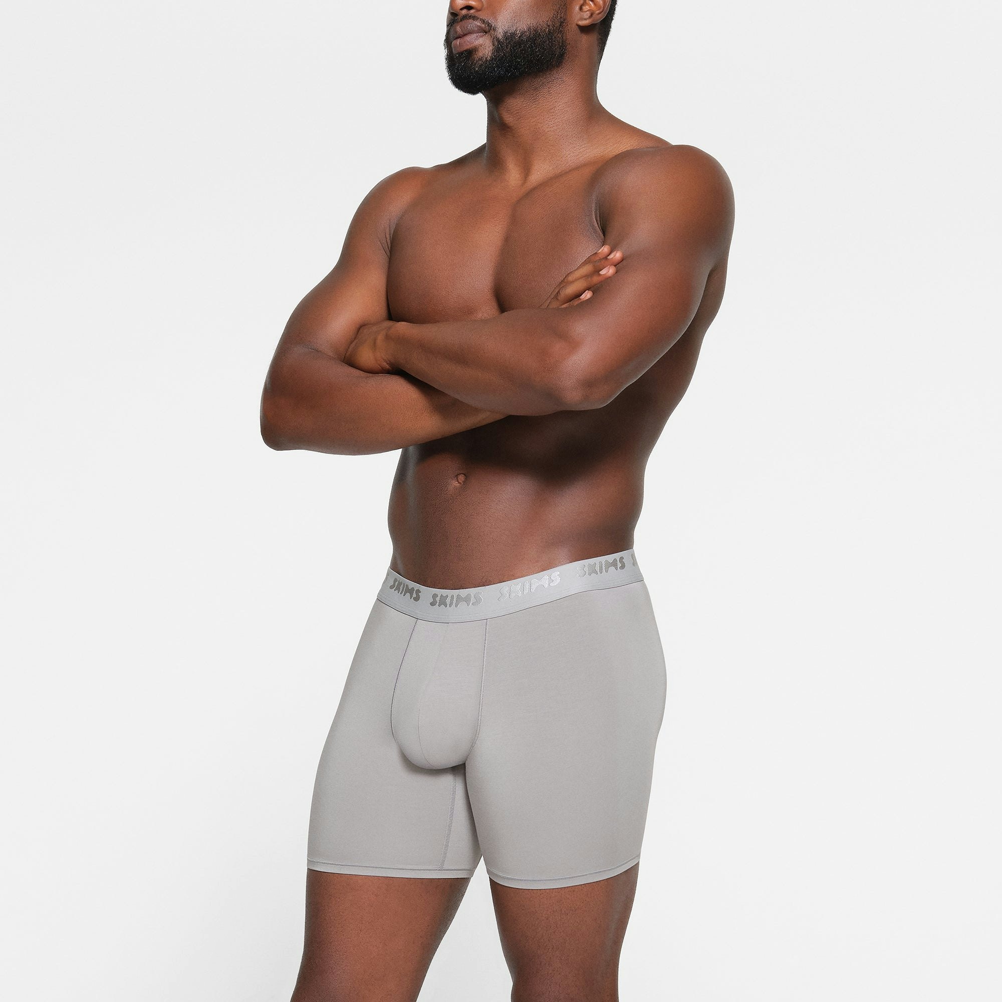 SKIMS STRETCH MENS 5" BOXER BRIEF 3-PACK WORN BY A MODEL IN SIDE VIEW