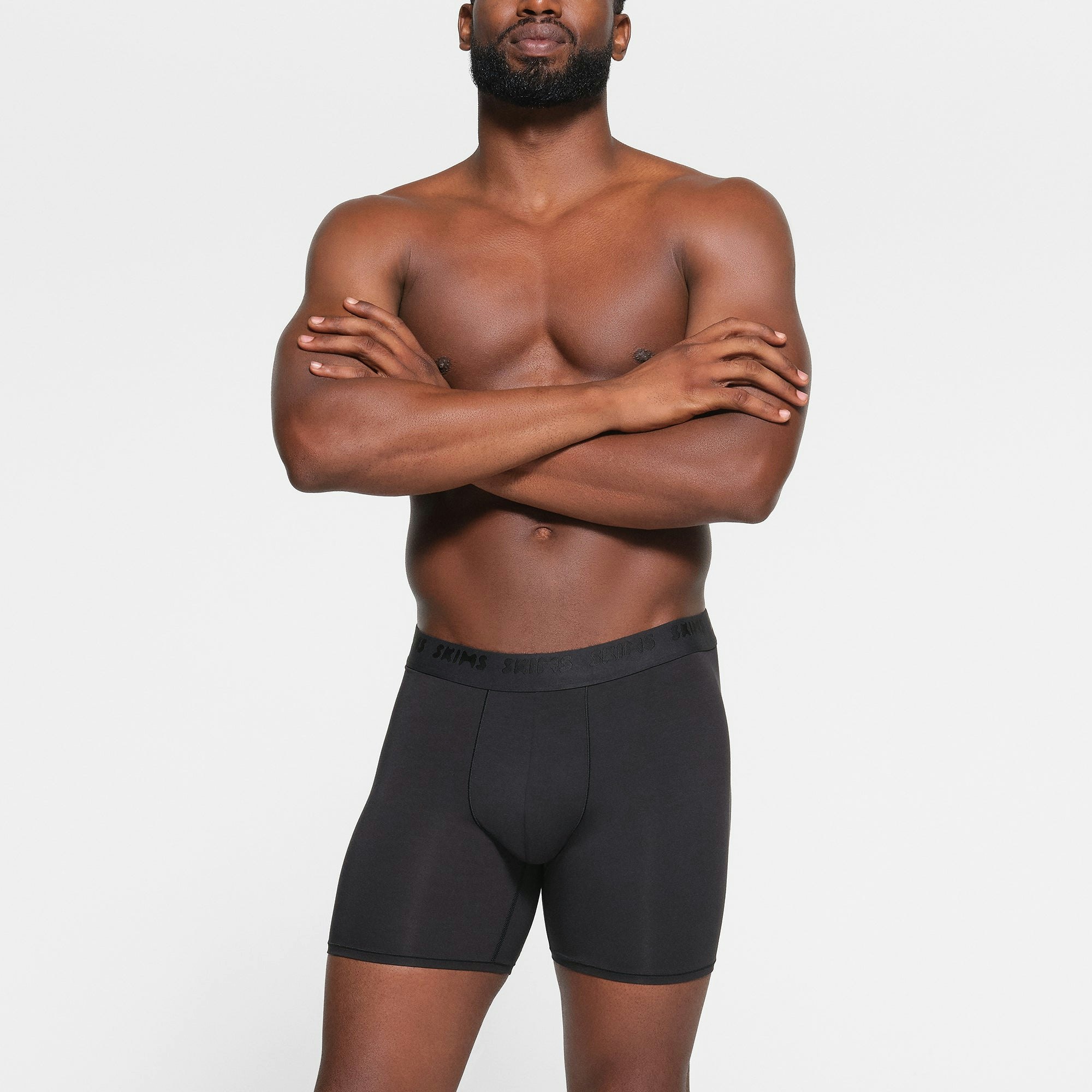 SKIMS STRETCH MENS 5" BOXER BRIEF 3-PACK WORN BY A MODEL IN FRONT VIEW