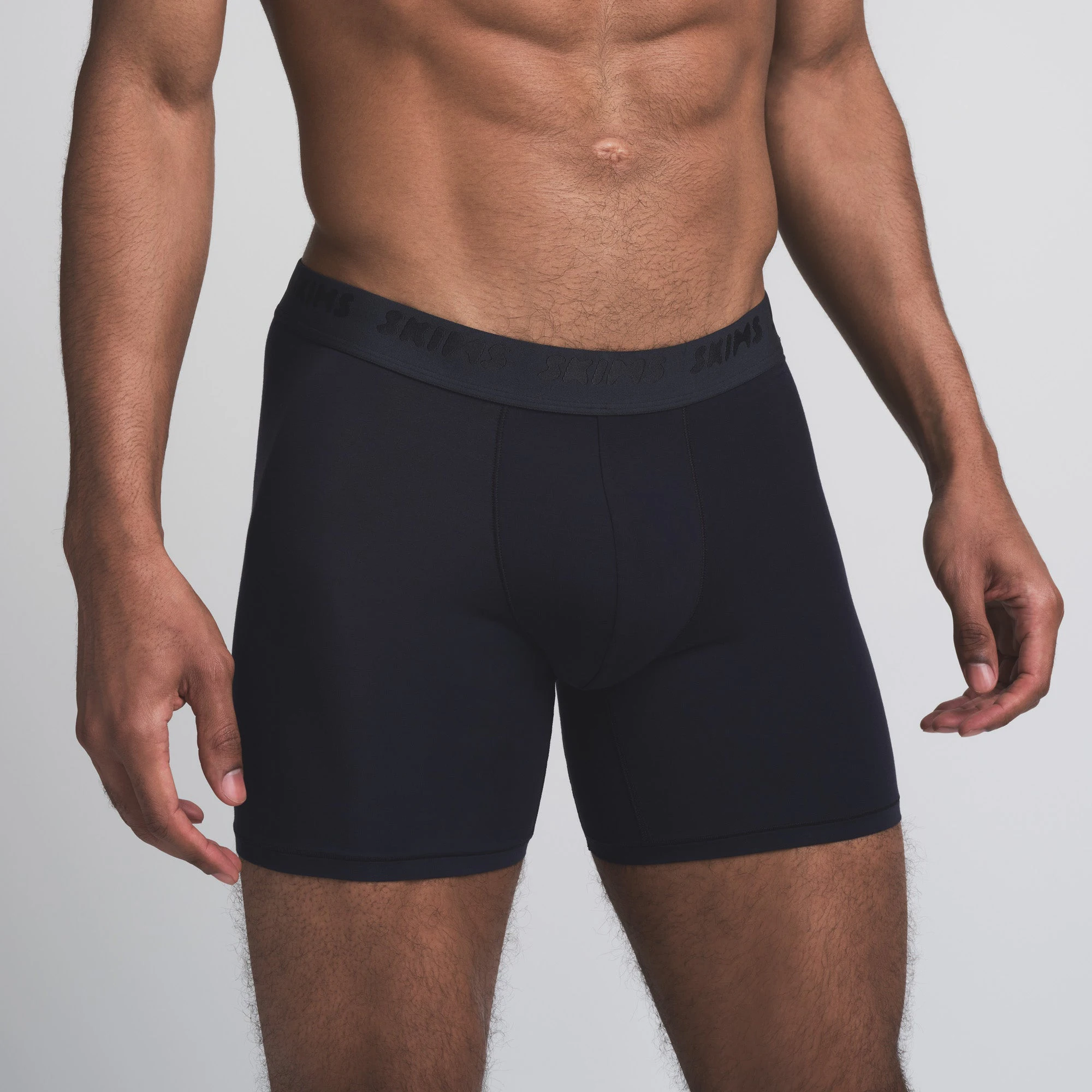 SKIMS STRETCH MENS 5 INCH BOXER BRIEF 3-PACK | INDIGO MULTI ON A MODEL FRONT VIEW | FOCUS: 0.0, 1.0, 0.9