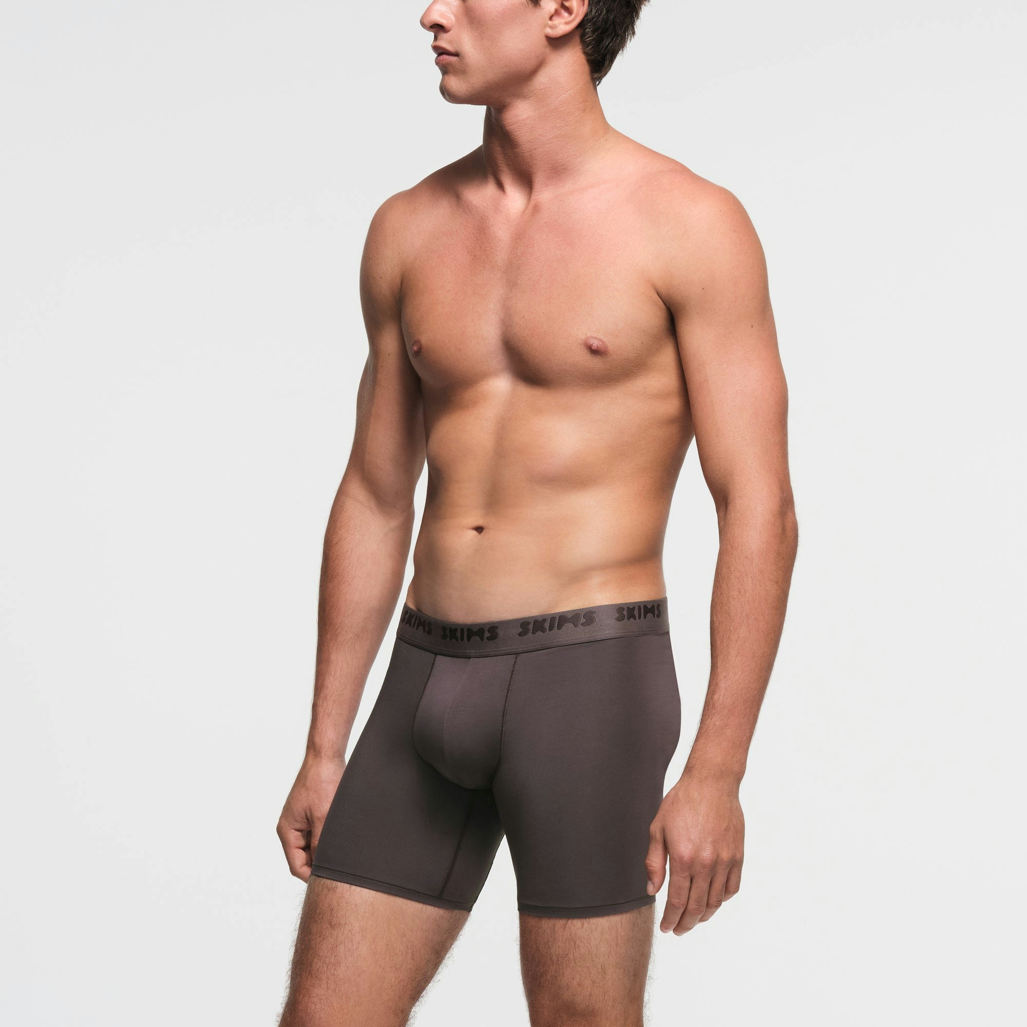 SKIMS STRETCH MENS 5" BOXER BRIEF | IRON ON A MODEL SIDE VIEW