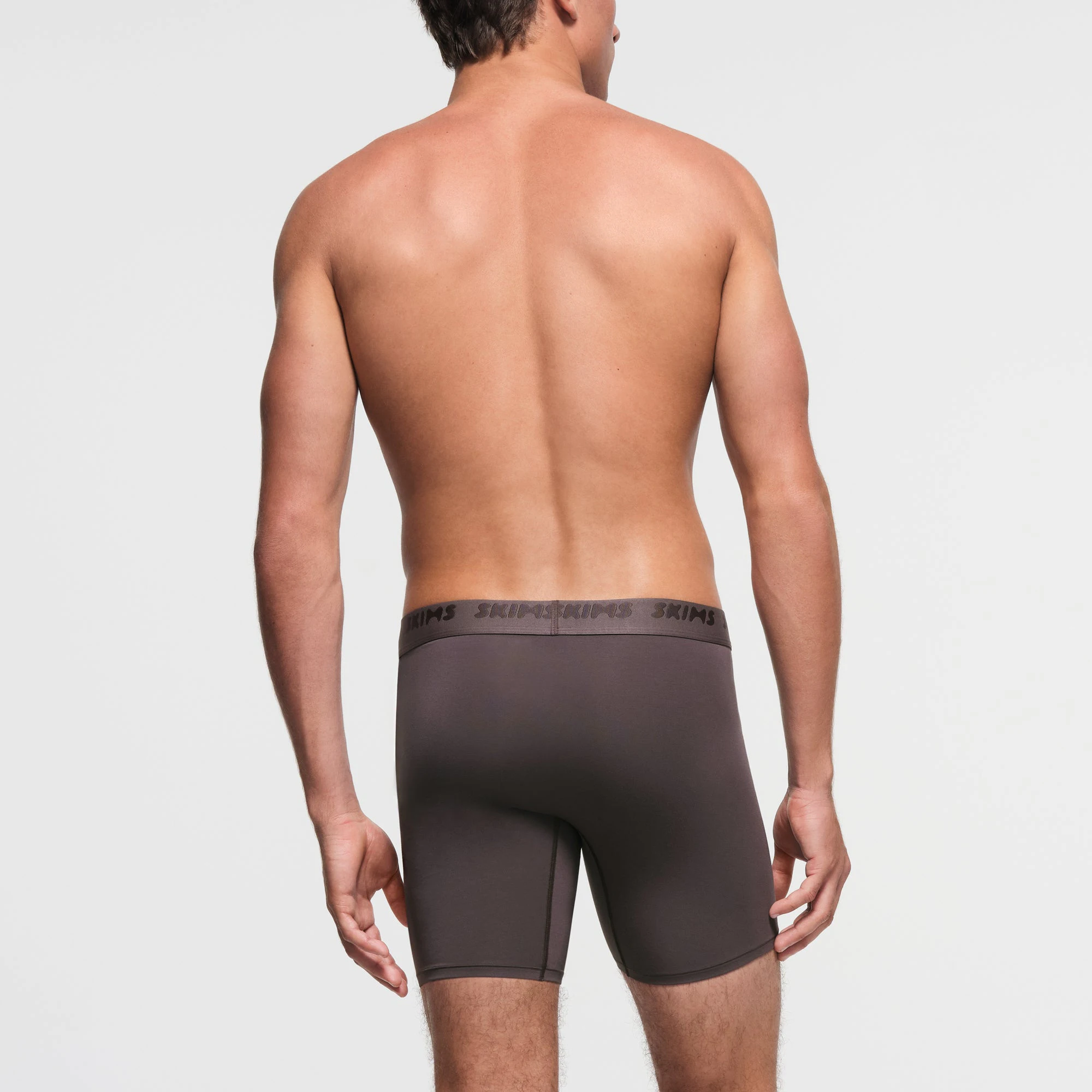 SKIMS STRETCH MENS 5" BOXER BRIEF | IRON ON A MODEL BACK VIEW