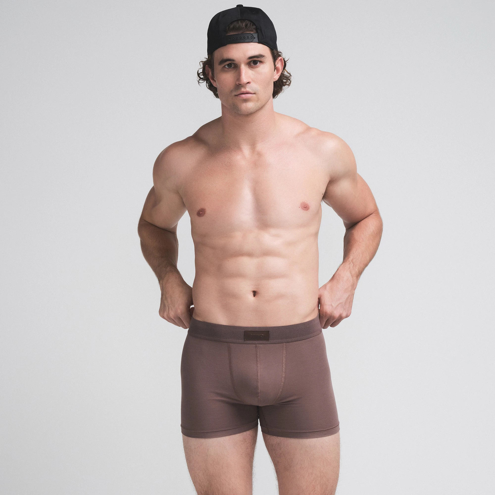 SKIMS COTTON MENS 3" BOXER BRIEF 3-PACK | BUBBLEGUM UMBER MULTI ON A MODEL SIDE VIEW | FOCUS: 0.0, 1.0, 0.9