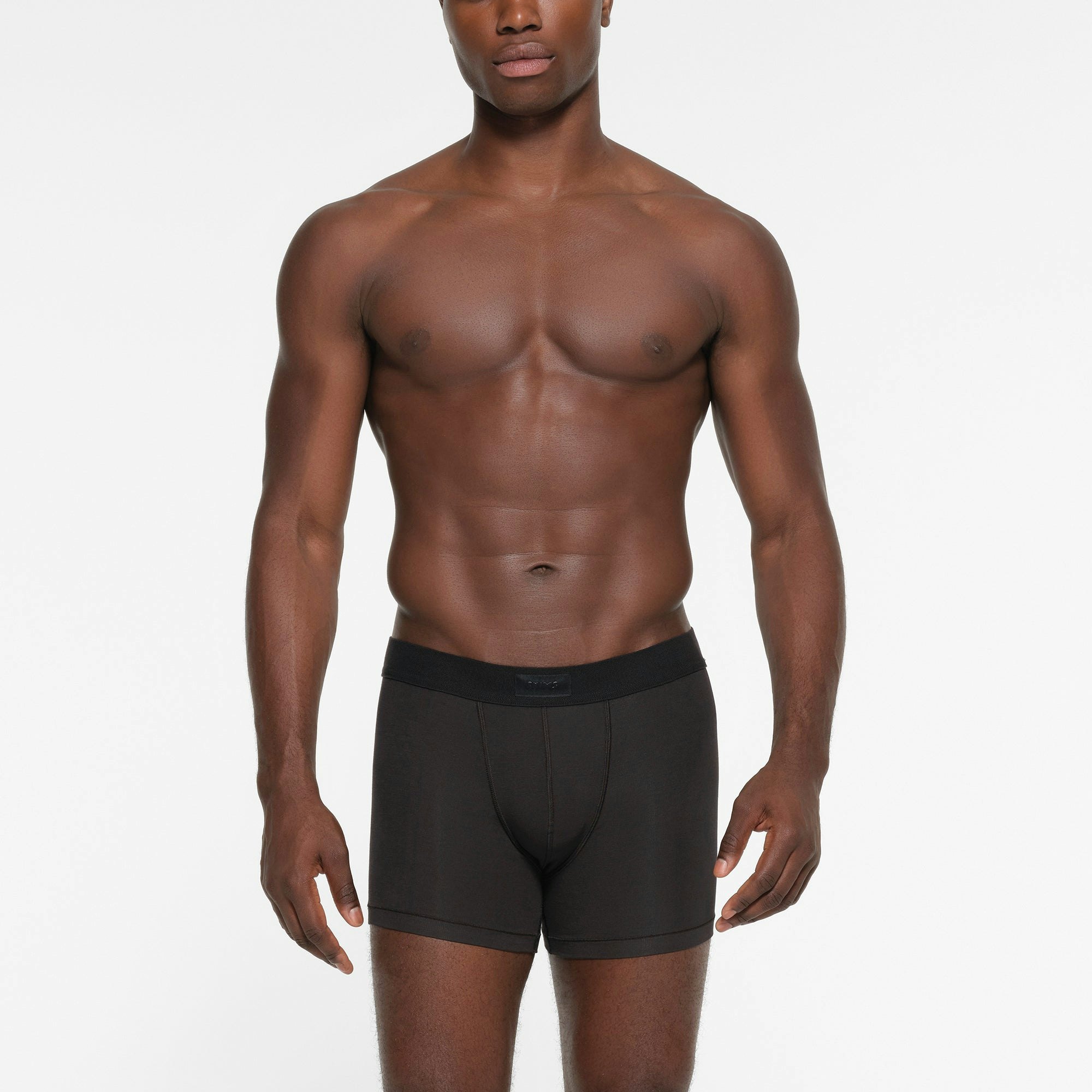 SKIMS COTTON MENS 3 INCH BOXER BRIEF 3-PACK | FAWN MULTI ON A MODEL FRONT VIEW