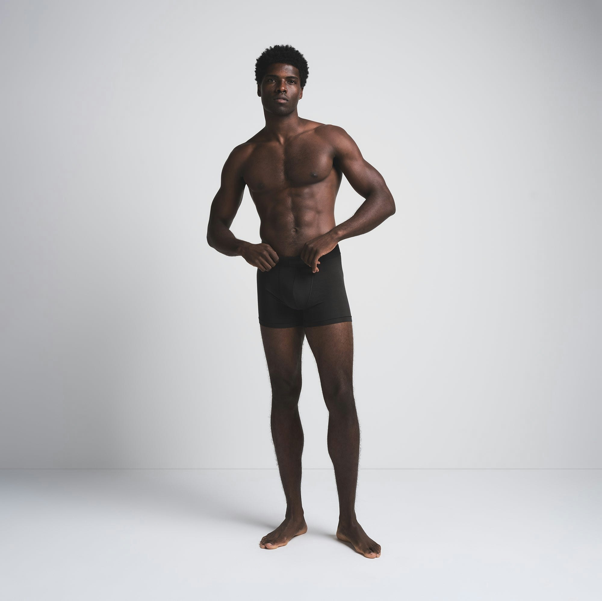 SKIMS COTTON MENS 3" BOXER BRIEF 3-PACK | MERLOT MULTI ON A MODEL FRONT VIEW