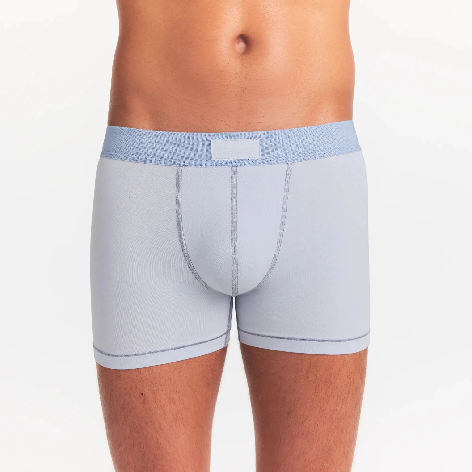 SKIMS COTTON MENS 3" BOXER BRIEF 3-PACK | NIMBUS MULTI ON A MODEL FRONT VIEW