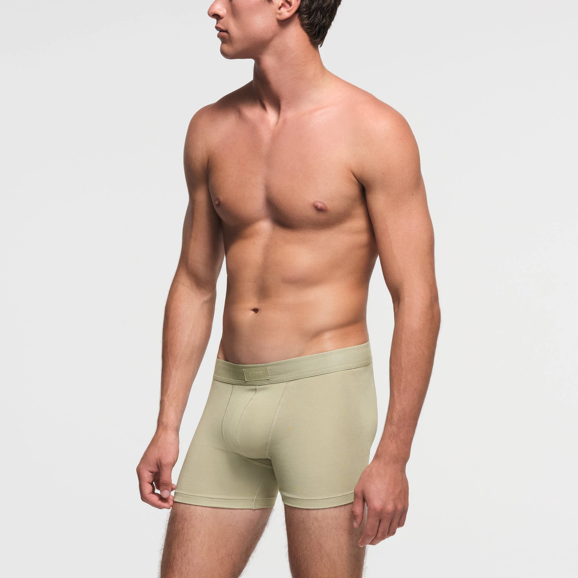 SKIMS COTTON MENS 3" BOXER BRIEF | PHOSPHORUS ON A MODEL SIDE VIEW