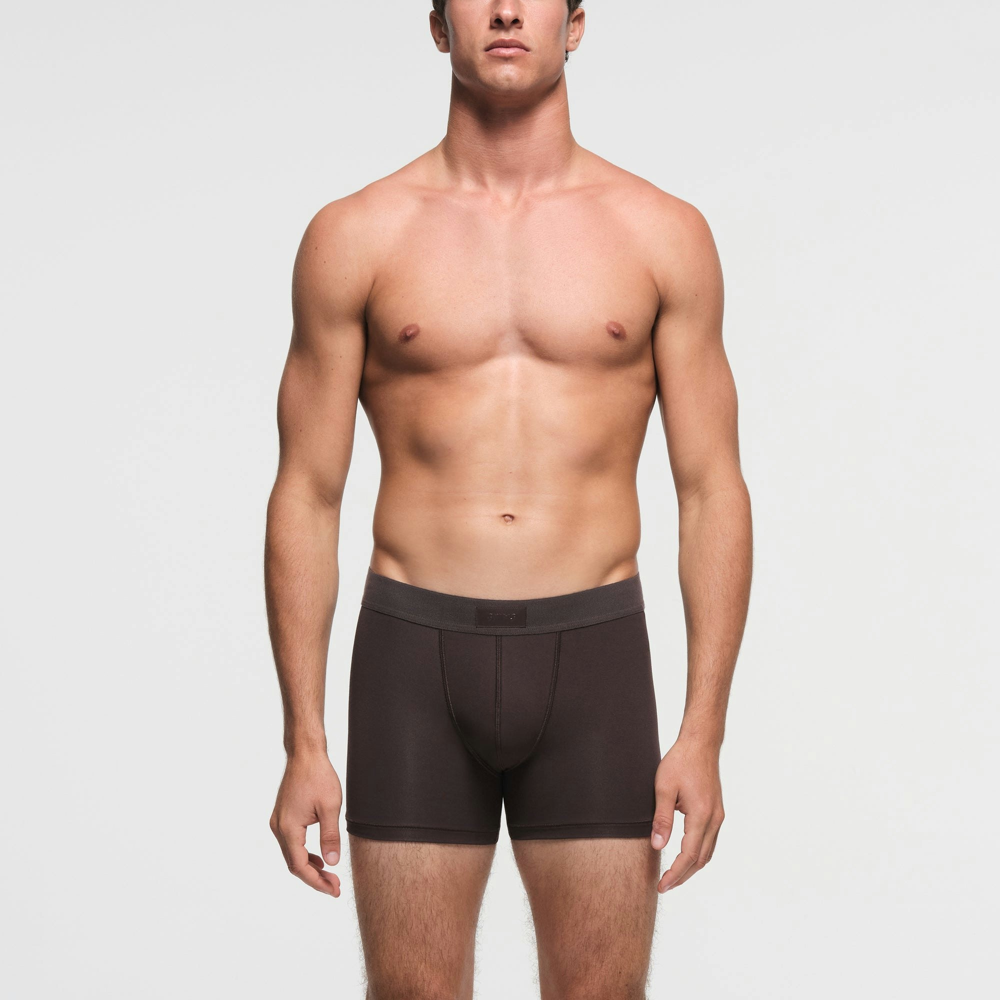 SKIMS COTTON MENS 3" BOXER BRIEF | PHOENIX ON A MODEL FRONT VIEW
