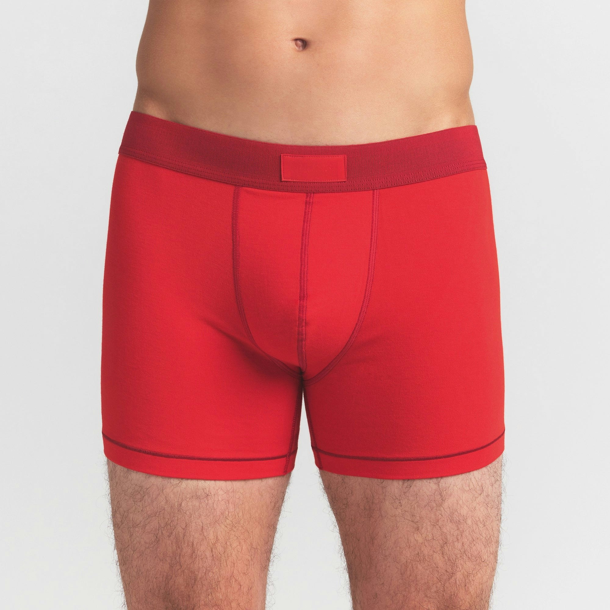 SKIMS COTTON MENS 3" BOXER BRIEF 3-PACK | RUBY ESPRESSO MULTI ON A MODEL FRONT VIEW @ | FOCUS: 0.0, 1.0, 0.9