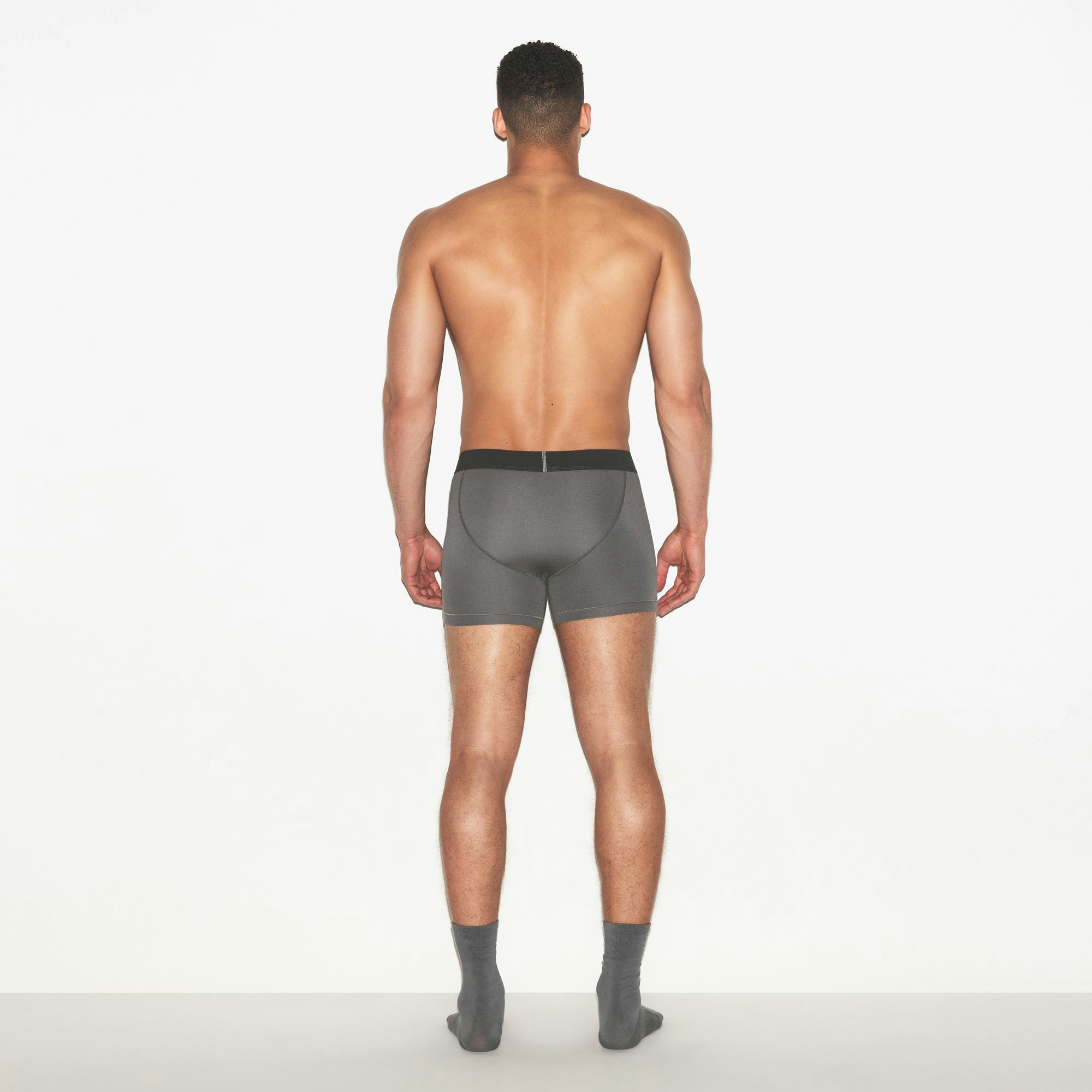 SKIMS COTTON MENS 3 INCH BOXER BRIEF 3-PACK | RUSSET MULTI ON A MODEL FRONT VIEW | FOCUS: 0.0, 1.0, 0.9