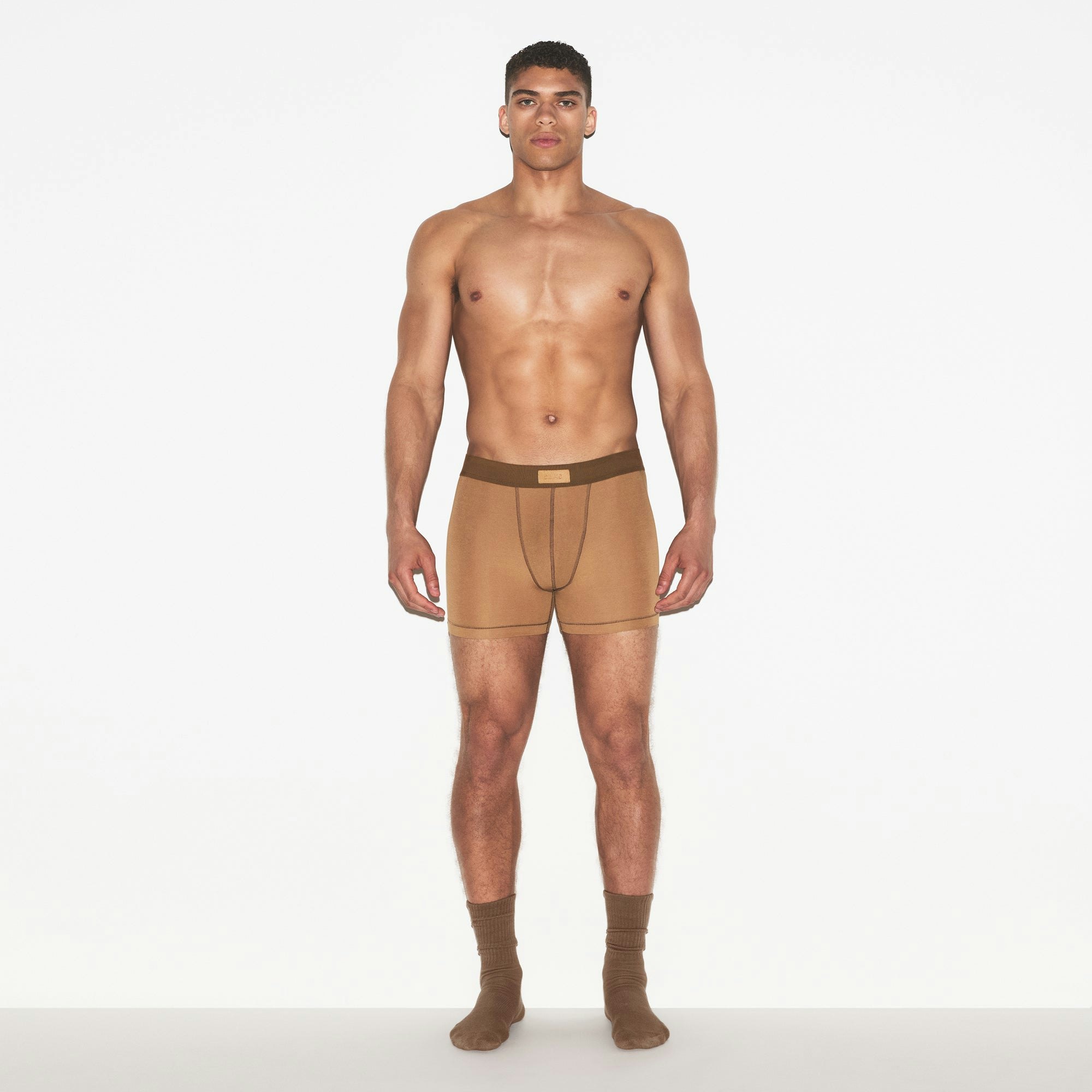 SKIMS COTTON MENS 3 INCH BOXER BRIEF 3-PACK | RUSSET MULTI ON A MODEL FRONT VIEW | FOCUS: 0.0, 1.0, 0.9