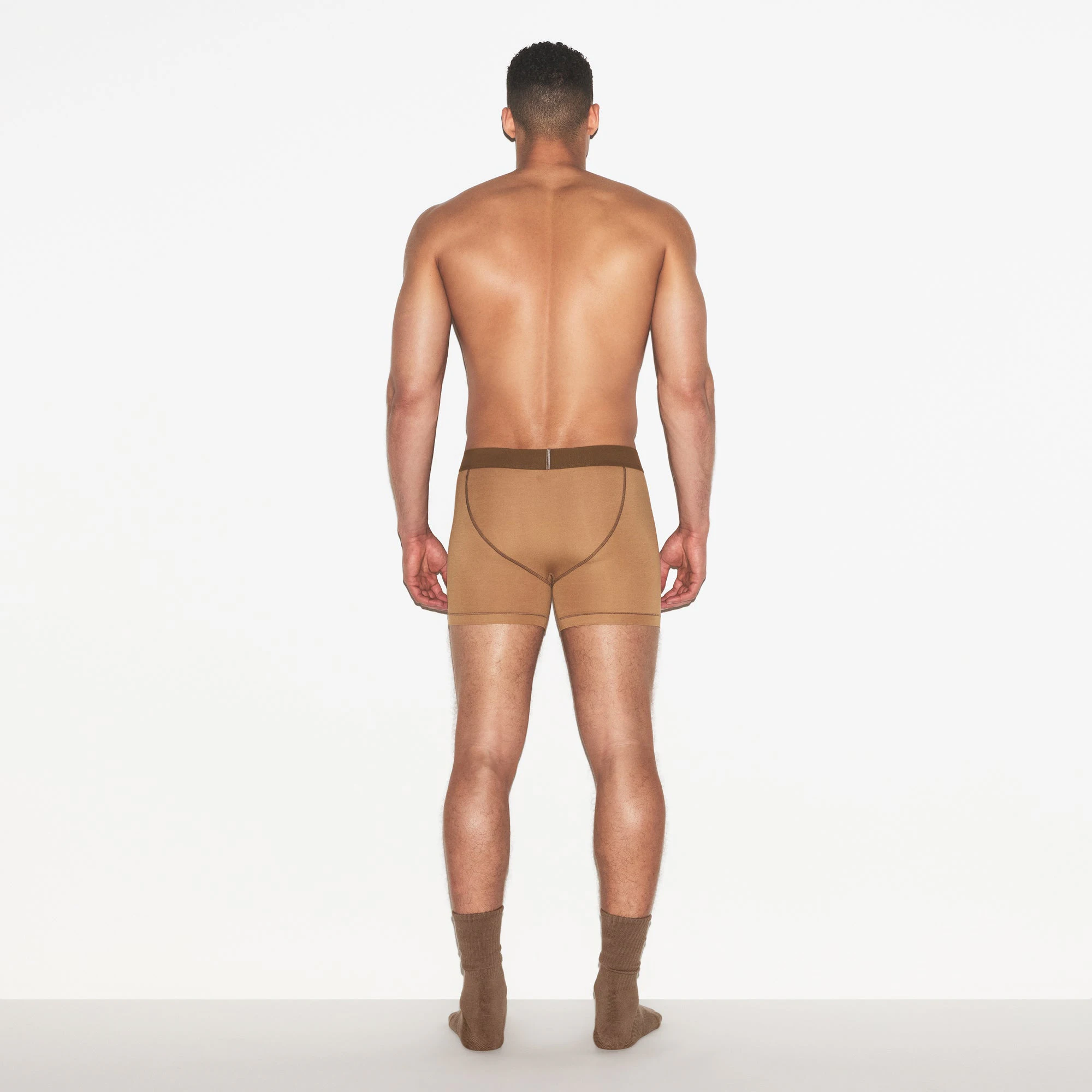 SKIMS COTTON MENS 3 INCH BOXER BRIEF 3-PACK | RUSSET MULTI ON A MODEL FRONT VIEW | FOCUS: 0.0, 1.0, 0.9