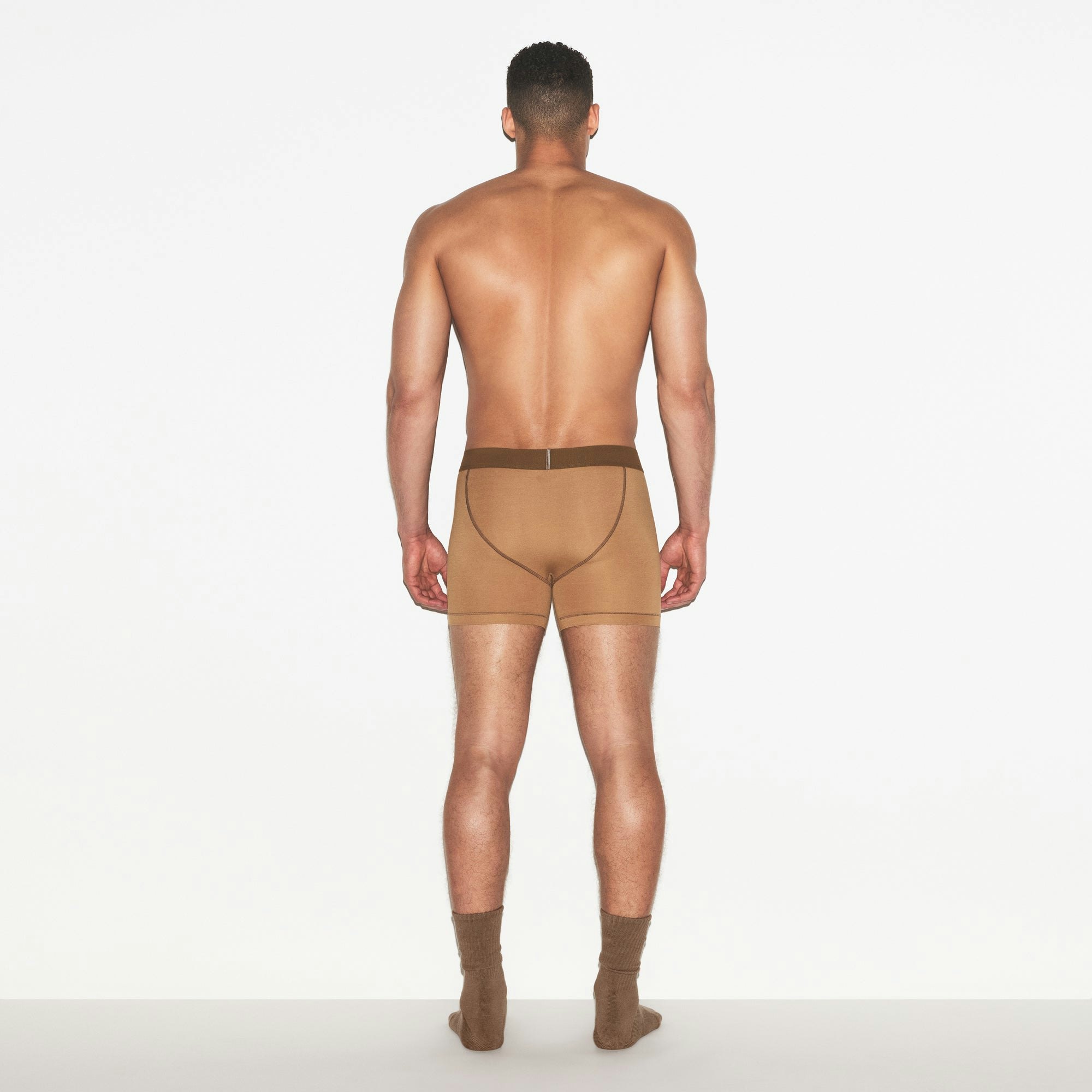 SKIMS COTTON MENS 3 INCH BOXER BRIEF 3-PACK | RUSSET MULTI ON A MODEL FRONT VIEW | FOCUS: 0.0, 1.0, 0.9