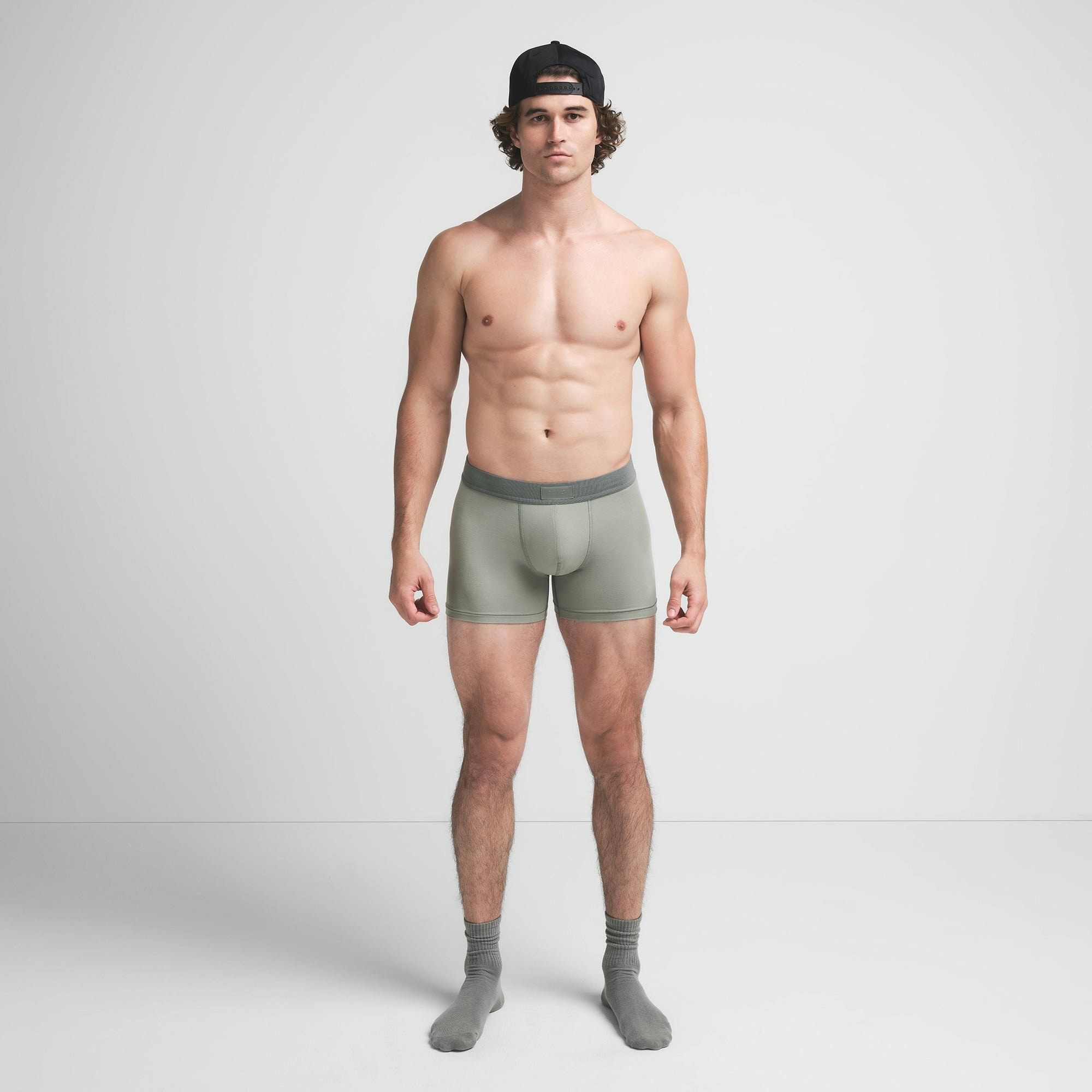 SKIMS COTTON MENS 3" BOXER BRIEF 3-PACK | STONE MULTI ON A MODEL FRONT VIEW @ | FOCUS: 0.9, 0.1, 0.7