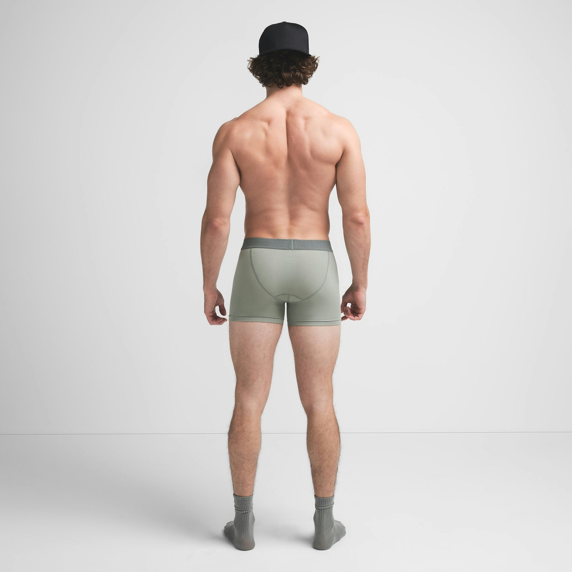 SKIMS COTTON MENS 3" BOXER BRIEF 3-PACK | STONE MULTI ON A MODEL BACK VIEW @ | FOCUS: 0.9, 0.1, 0.7