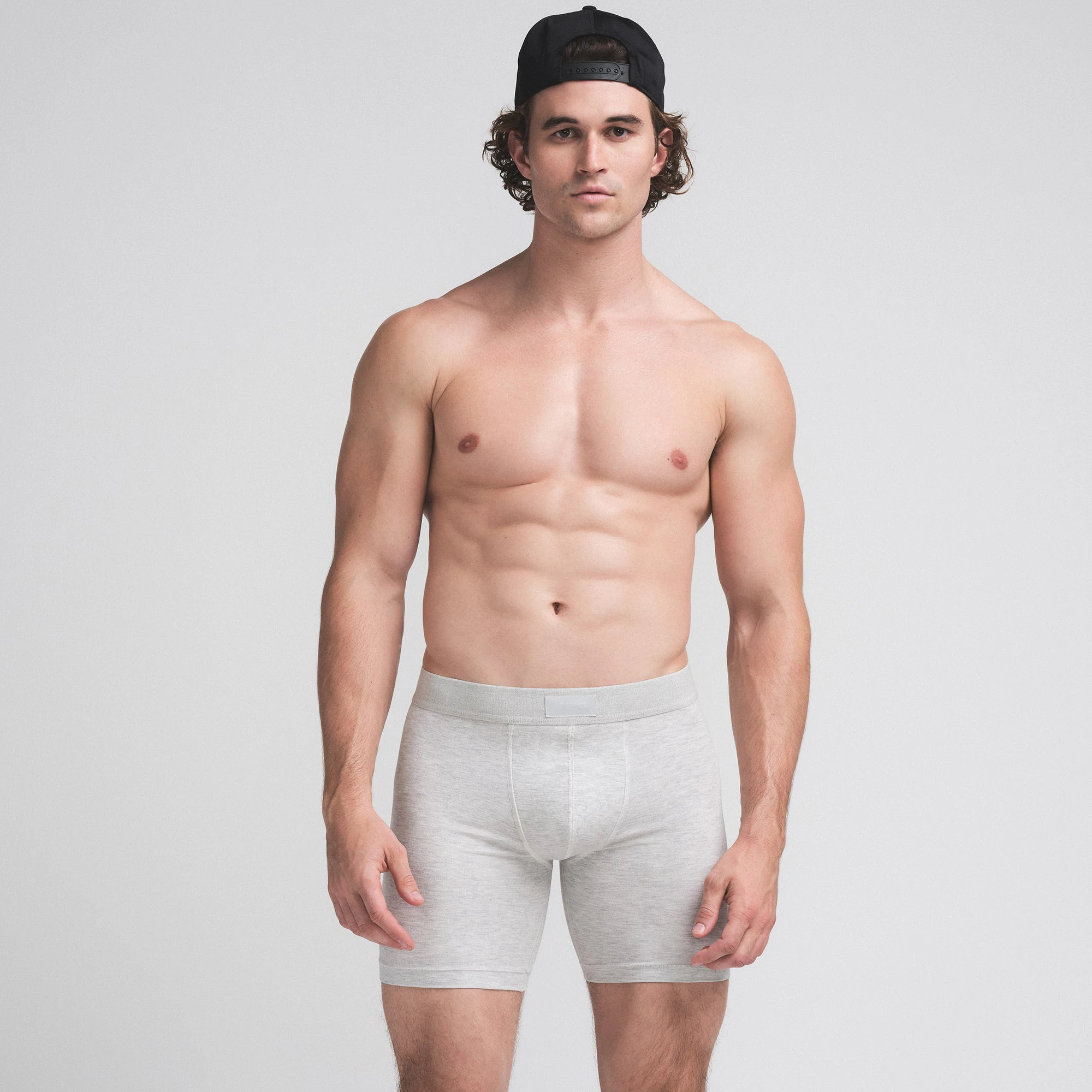 SKIMS COTTON MENS 5" BOXER BRIEF 3-PACK | BUBBLEGUM UMBER MULTI ON A MODEL SIDE VIEW | FOCUS: 0.0, 1.0, 0.9