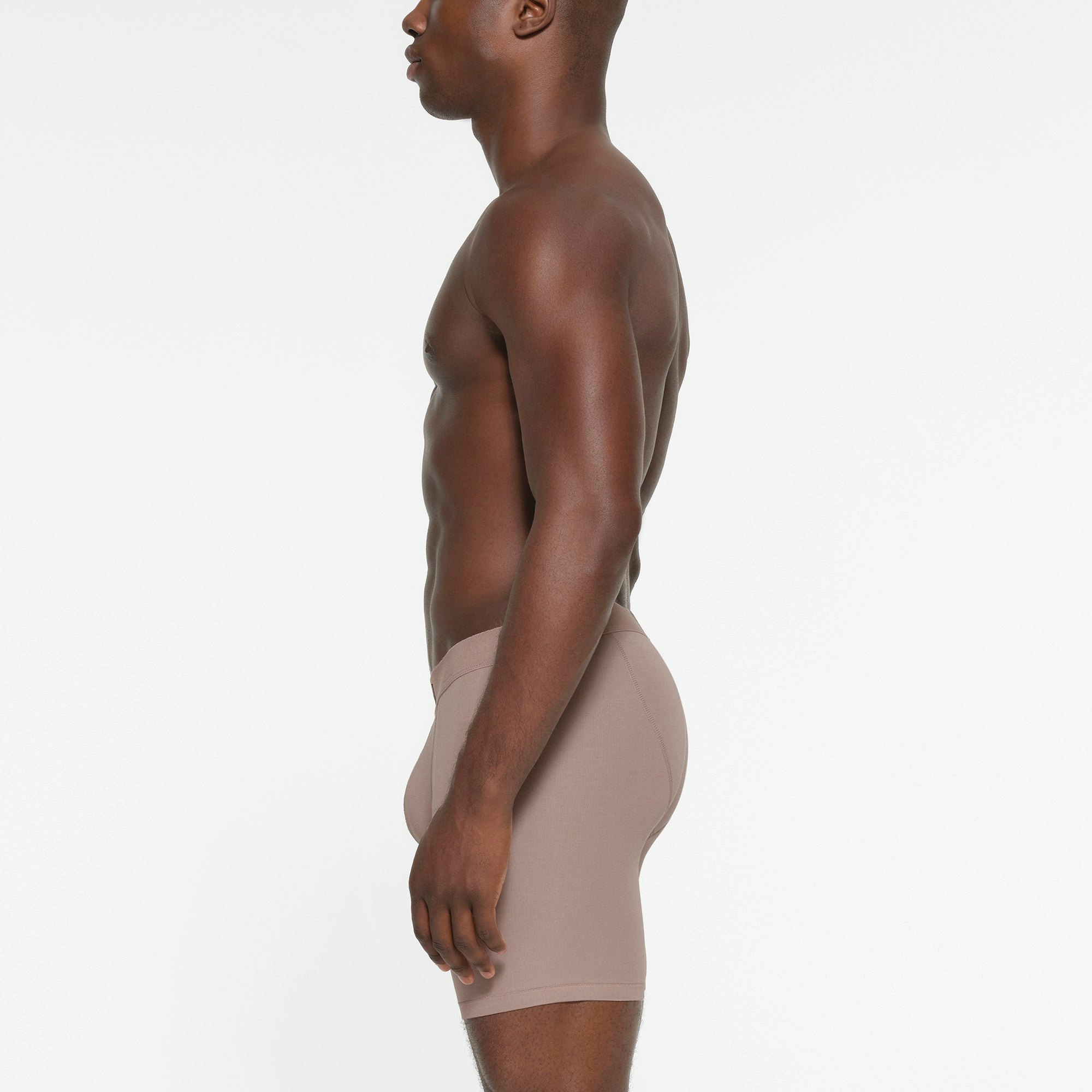 SKIMS COTTON MENS 5 INCH BOXER BRIEF 3 PACK | FAWN MULTI ON A MODEL SIDE VIEW
