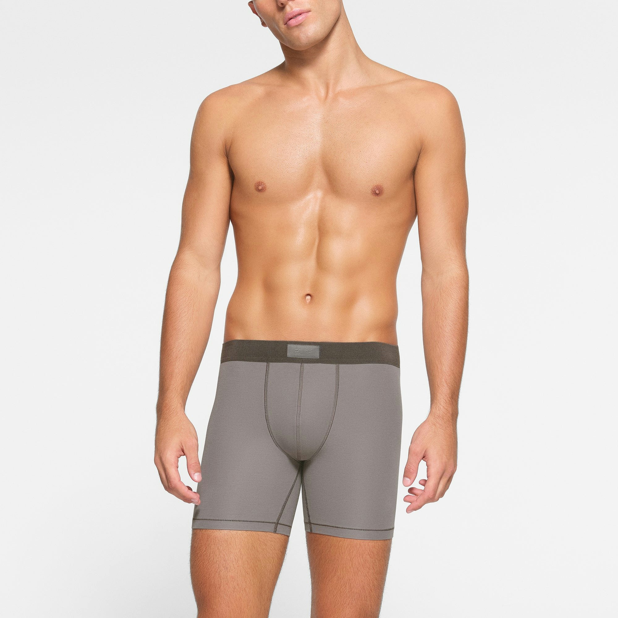SKIMS COTTON MENS 5" BOXER BRIEF 3-PACK WORN BY A MODEL IN FRONT VIEW