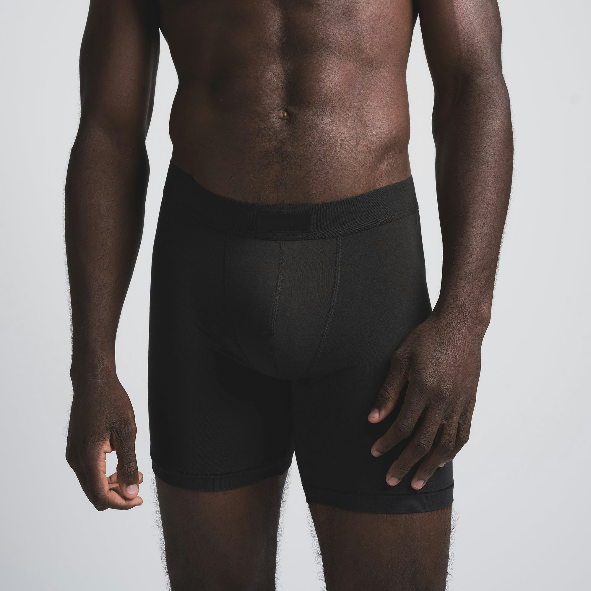 SKIMS COTTON MENS 5" BOXER BRIEF 3-PACK | MERLOT MULTI ON A MODEL SIDE VIEW