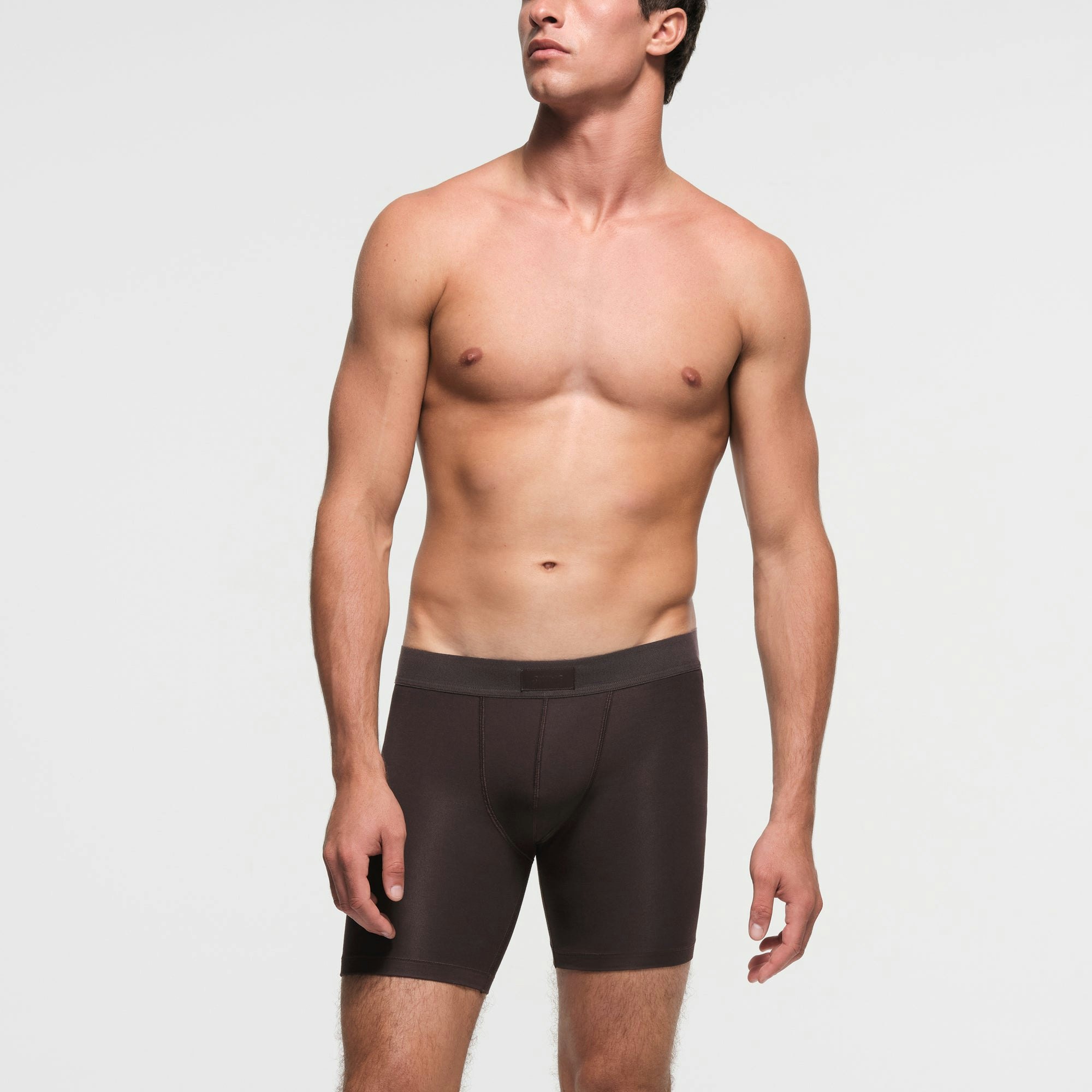 SKIMS COTTON MENS 5" BOXER BRIEF | PHOENIX ON A MODEL FRONT VIEW