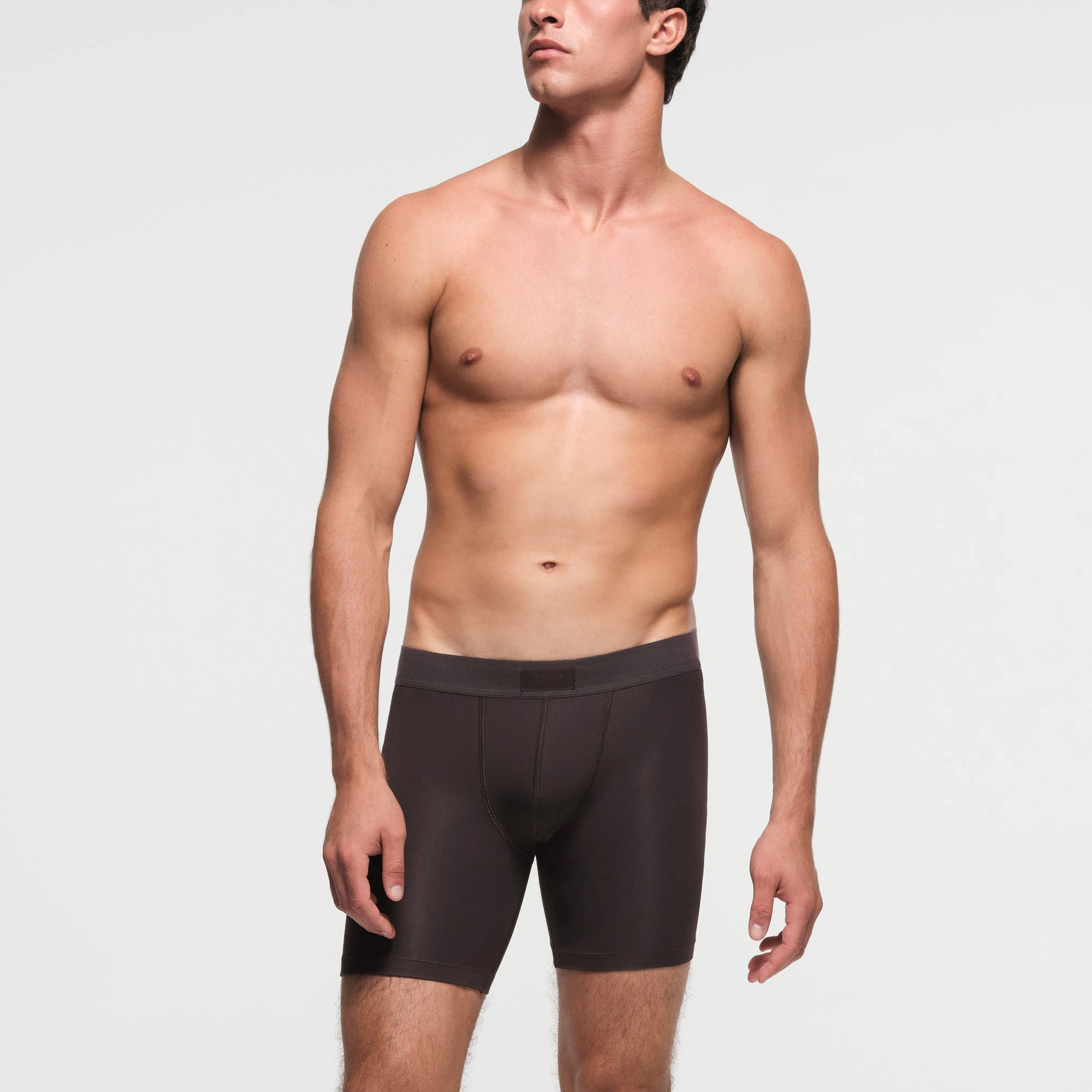 SKIMS COTTON MENS 5" BOXER BRIEF | PHOENIX ON A MODEL FRONT VIEW