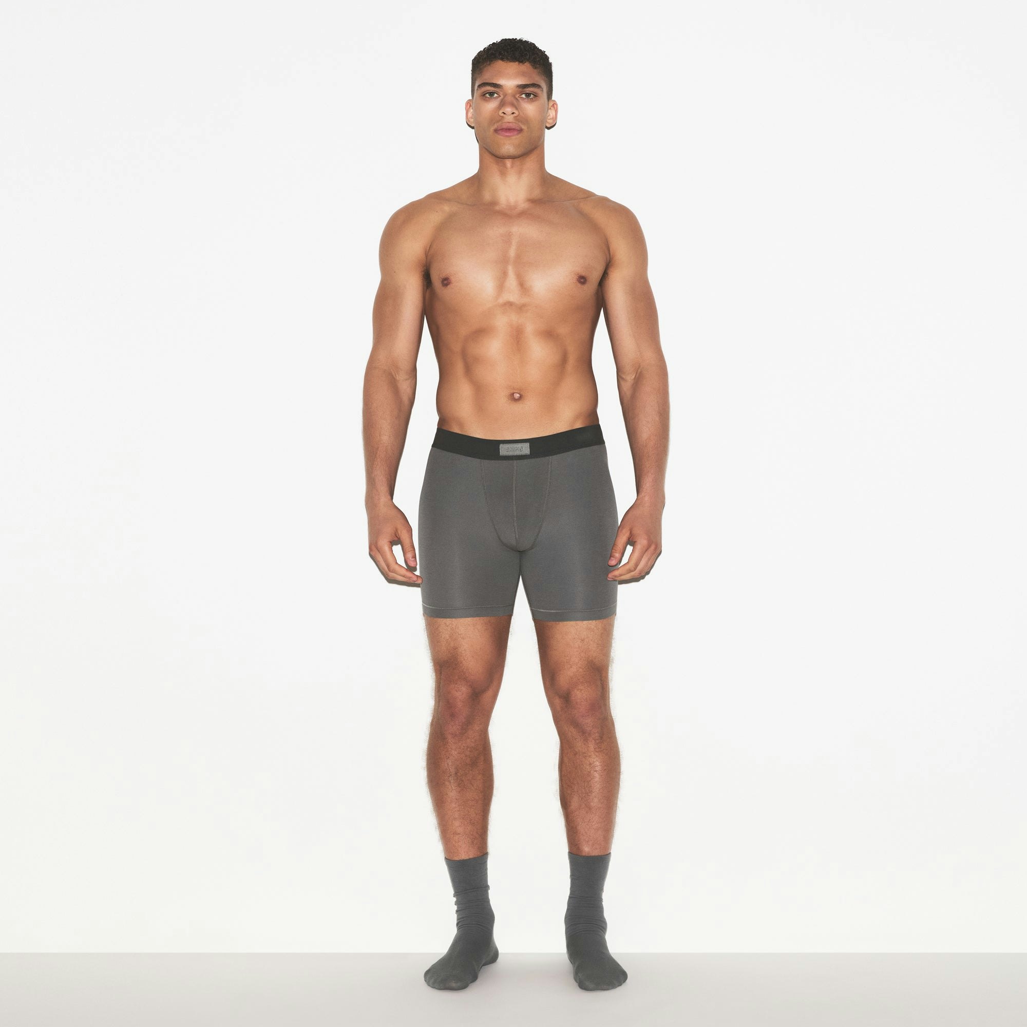 SKIMS COTTON MENS 5 INCH BOXER BRIEF 3-PACK | RUSSET MULTI ON A MODEL FRONT VIEW | FOCUS: 0.0, 1.0, 0.9