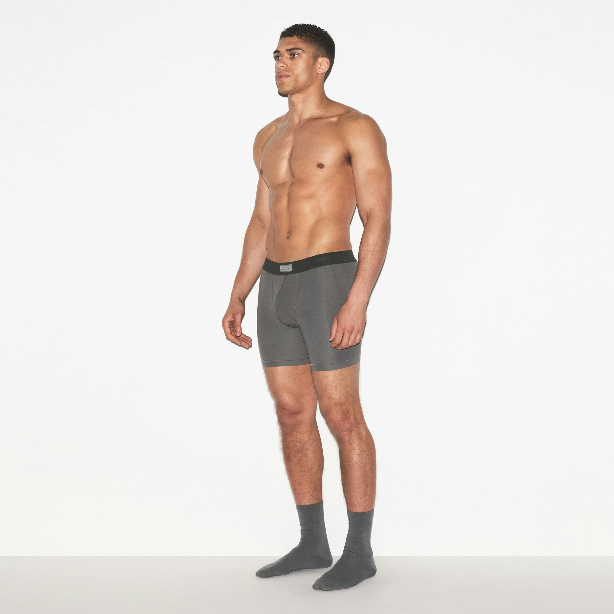 SKIMS COTTON MENS 5 INCH BOXER BRIEF 3-PACK | RUSSET MULTI ON A MODEL FRONT VIEW | FOCUS: 0.0, 1.0, 0.9