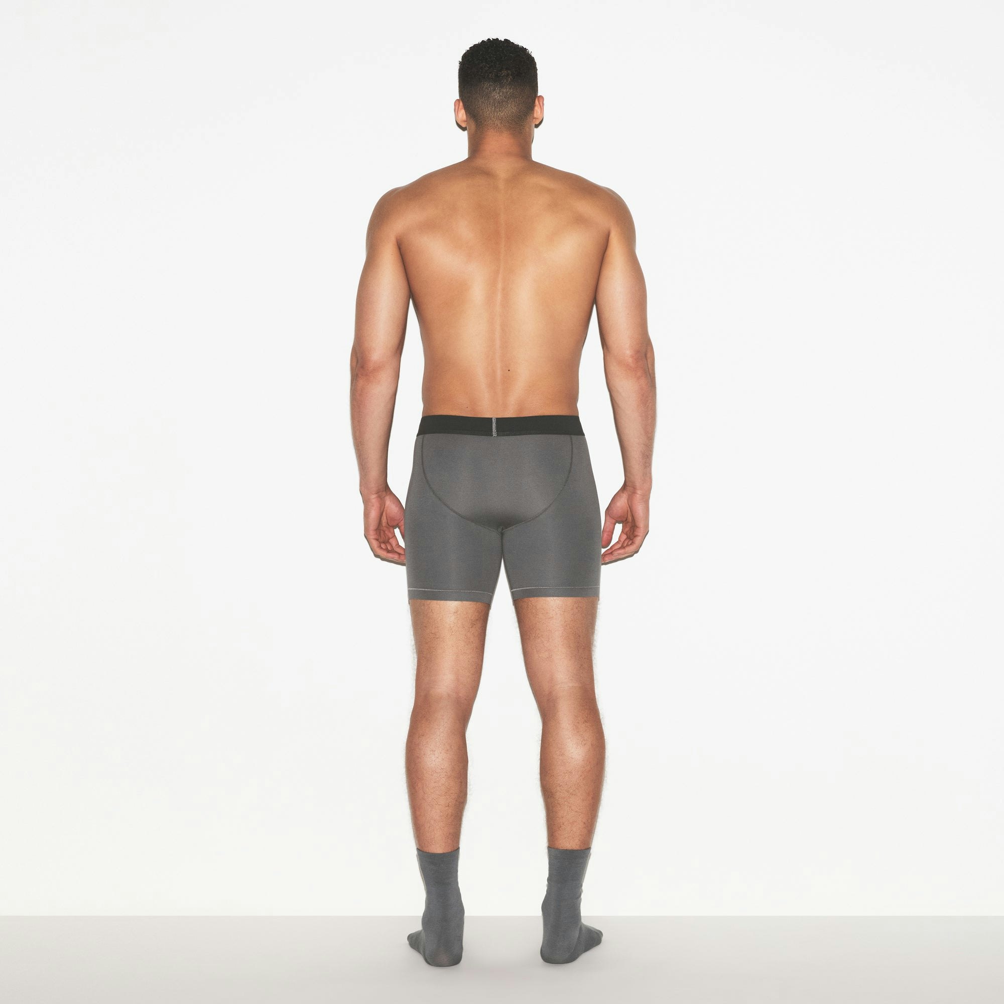 SKIMS COTTON MENS 5 INCH BOXER BRIEF 3-PACK | RUSSET MULTI ON A MODEL FRONT VIEW | FOCUS: 0.0, 1.0, 0.9