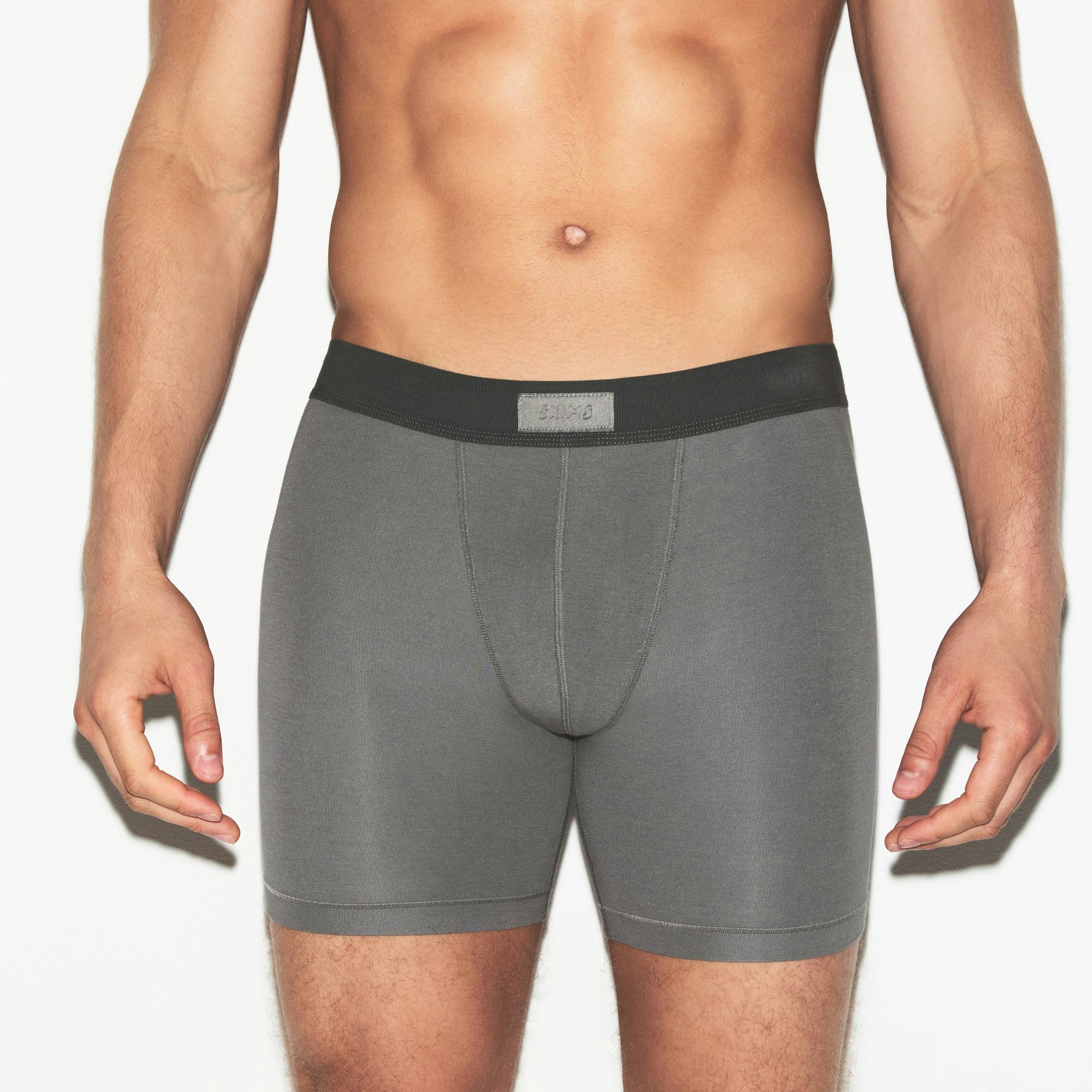 SKIMS COTTON MENS 5 INCH BOXER BRIEF 3-PACK | RUSSET MULTI ON A MODEL SIDE VIEW | FOCUS: 0.0, 1.0, 0.9